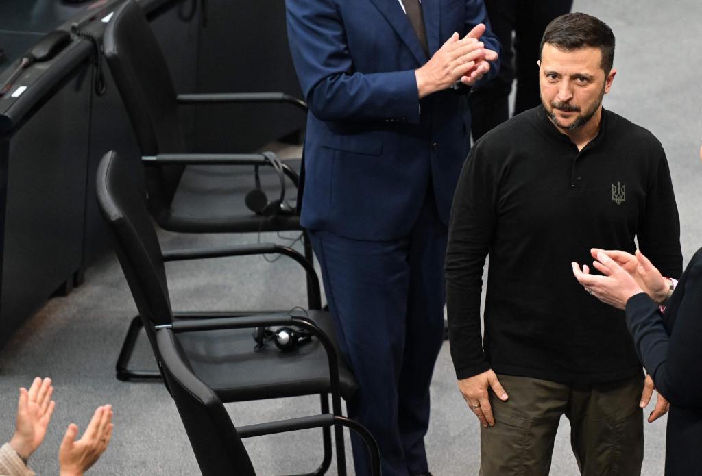 Zelensky is applauded after giving a speech at the German Bundestag.