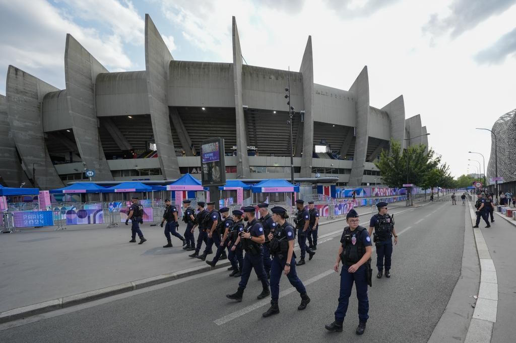 Police clear the streets at the Parc des Princes during the 2024 Olympics.