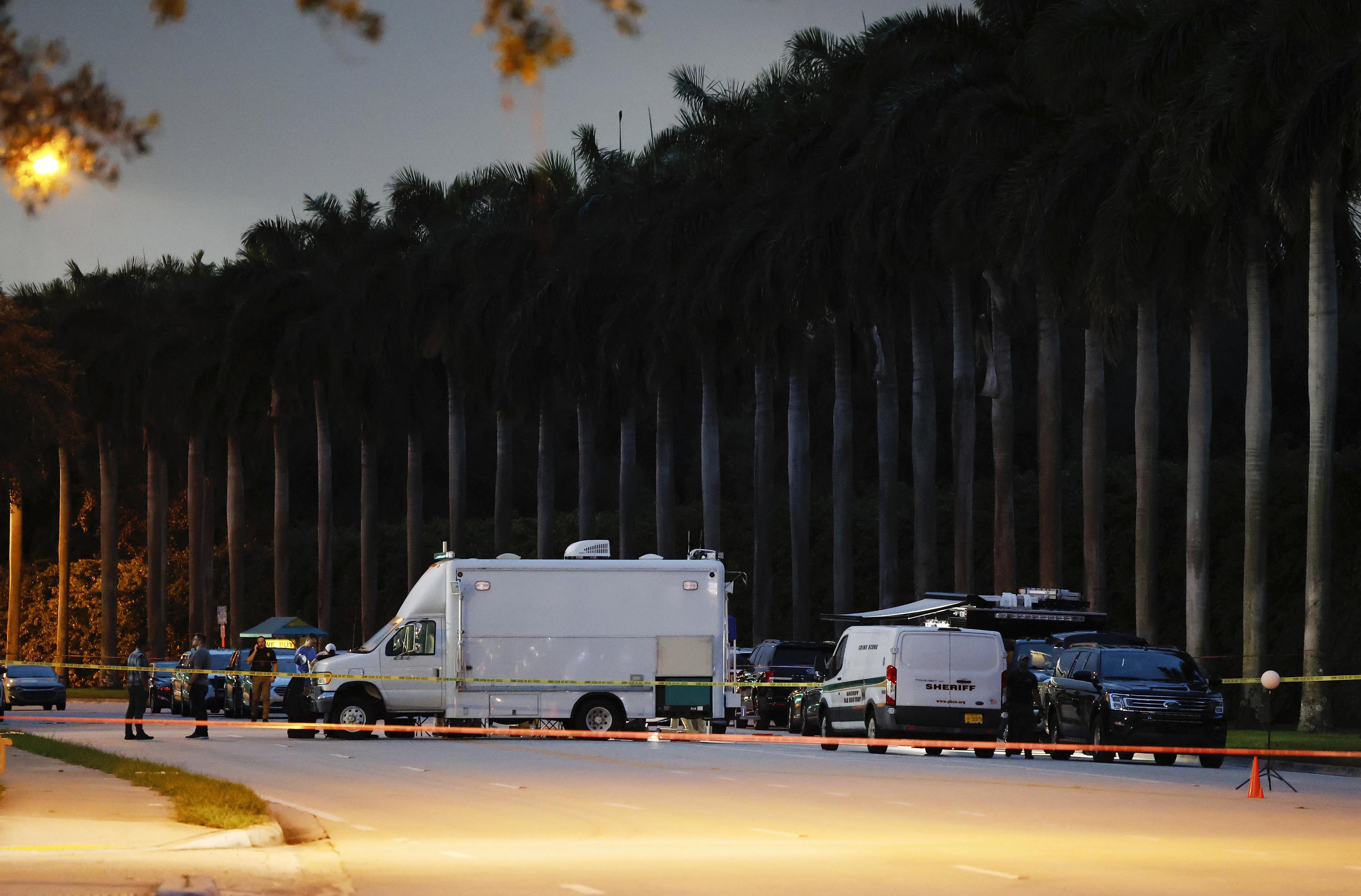 Police crime scene vehicles are seen at Trump International Golf Club.