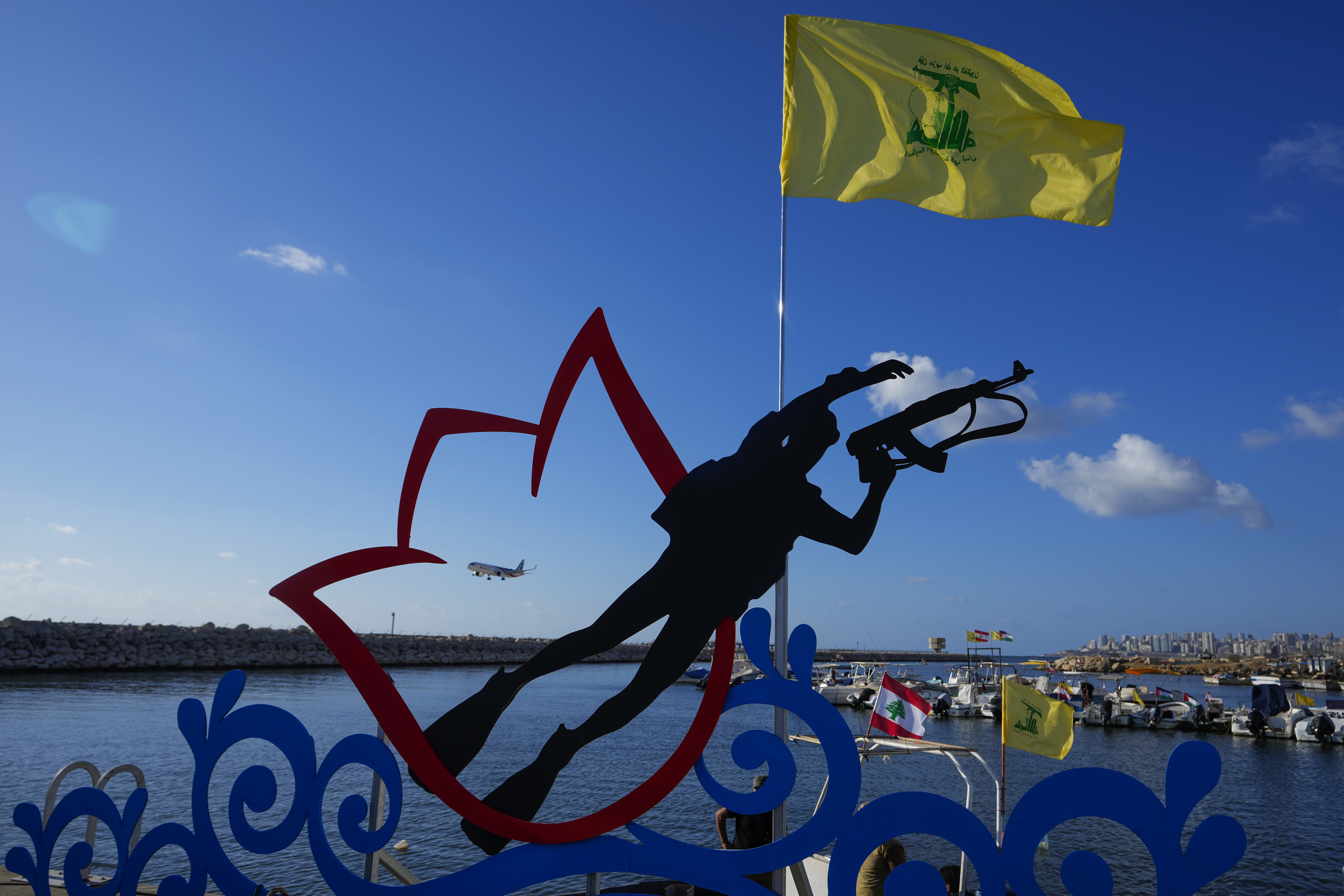 A Middle East Airlines passenger plane is seen inside a statue symbolizing a Hezbollah armed diver