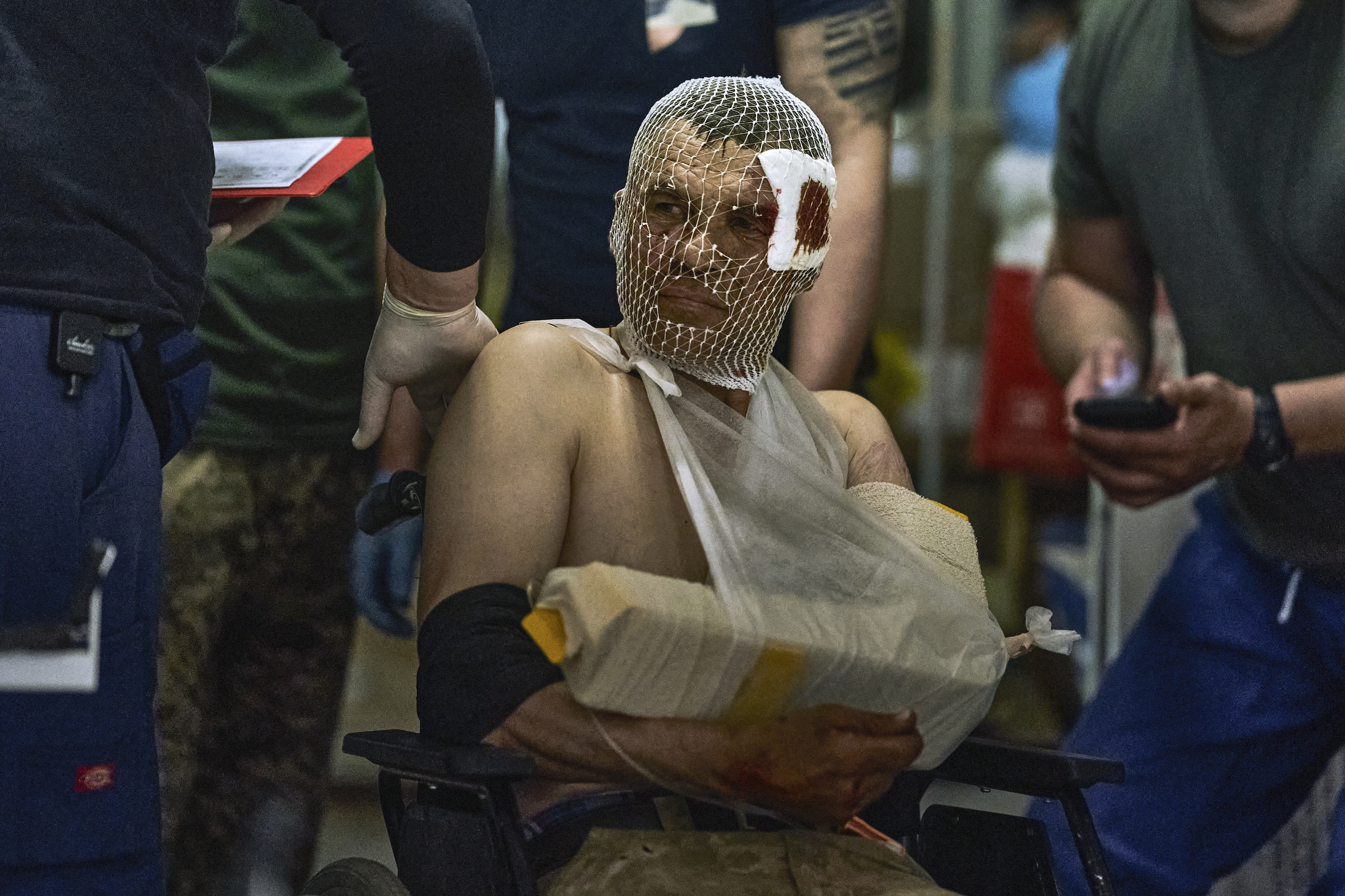 A wounded Ukrainian soldier at a medical stabilisation point near Bakhmut