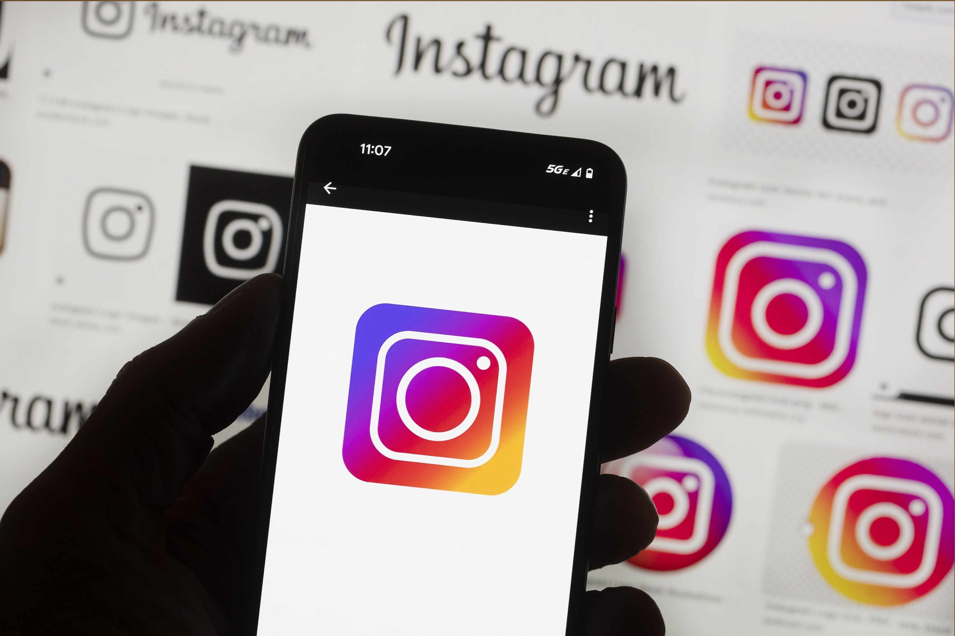 The Instagram logo is seen on a cell phone