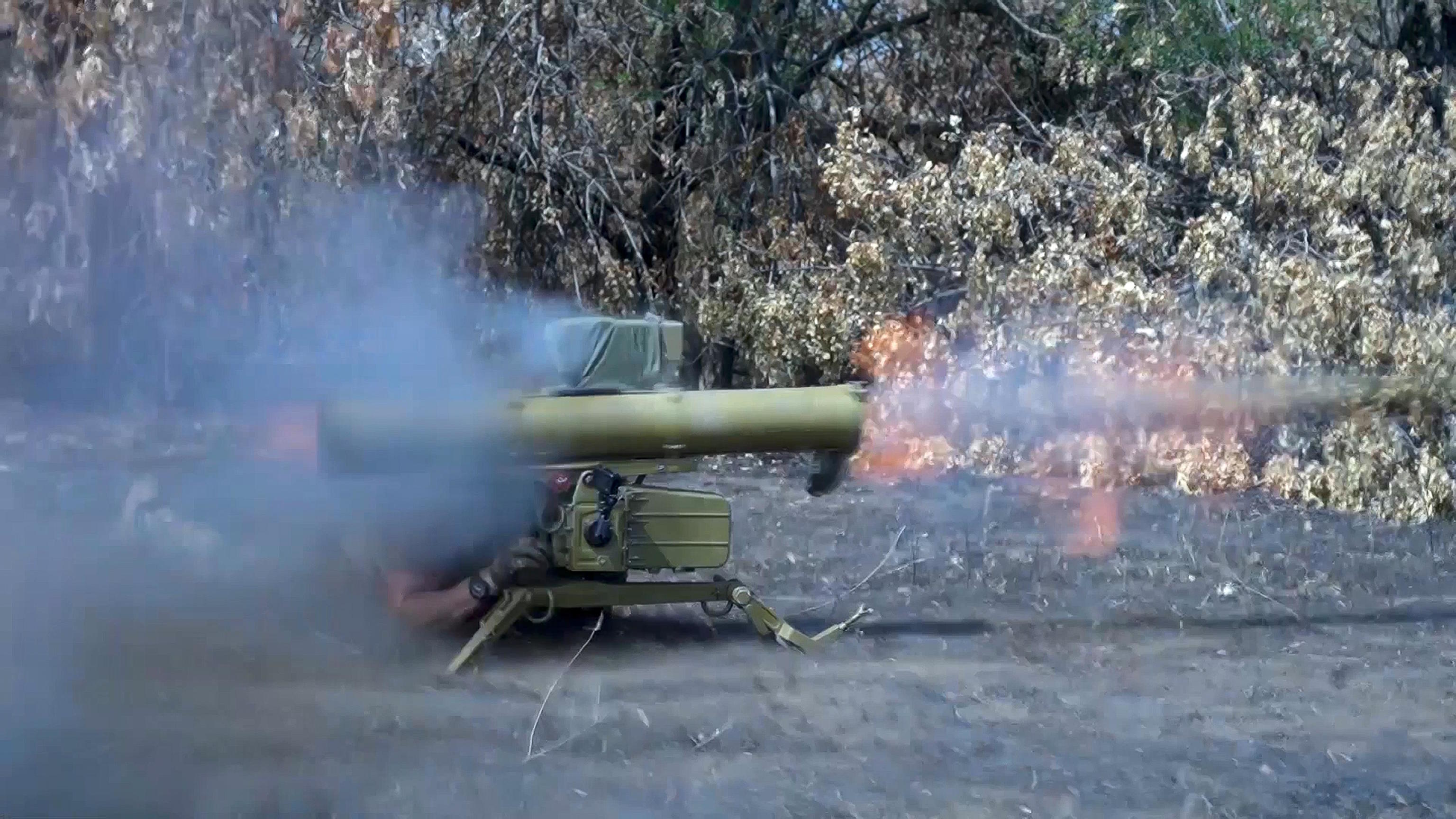 A Russian soldier fires an anti-tank missile at Ukrainian forces.