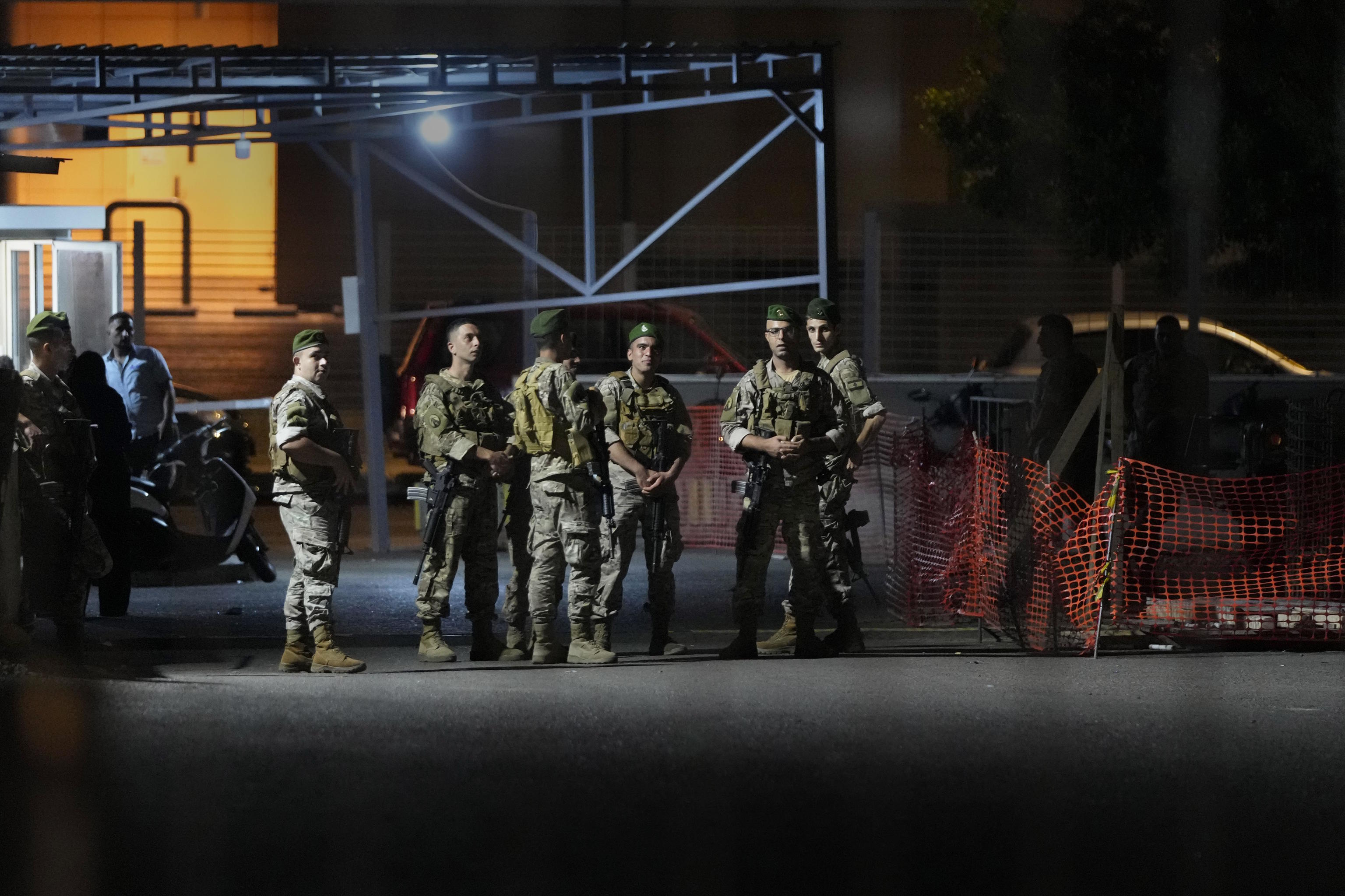 Lebanese soldiers stand guard to detonate a walkie-talkie in Beirut.