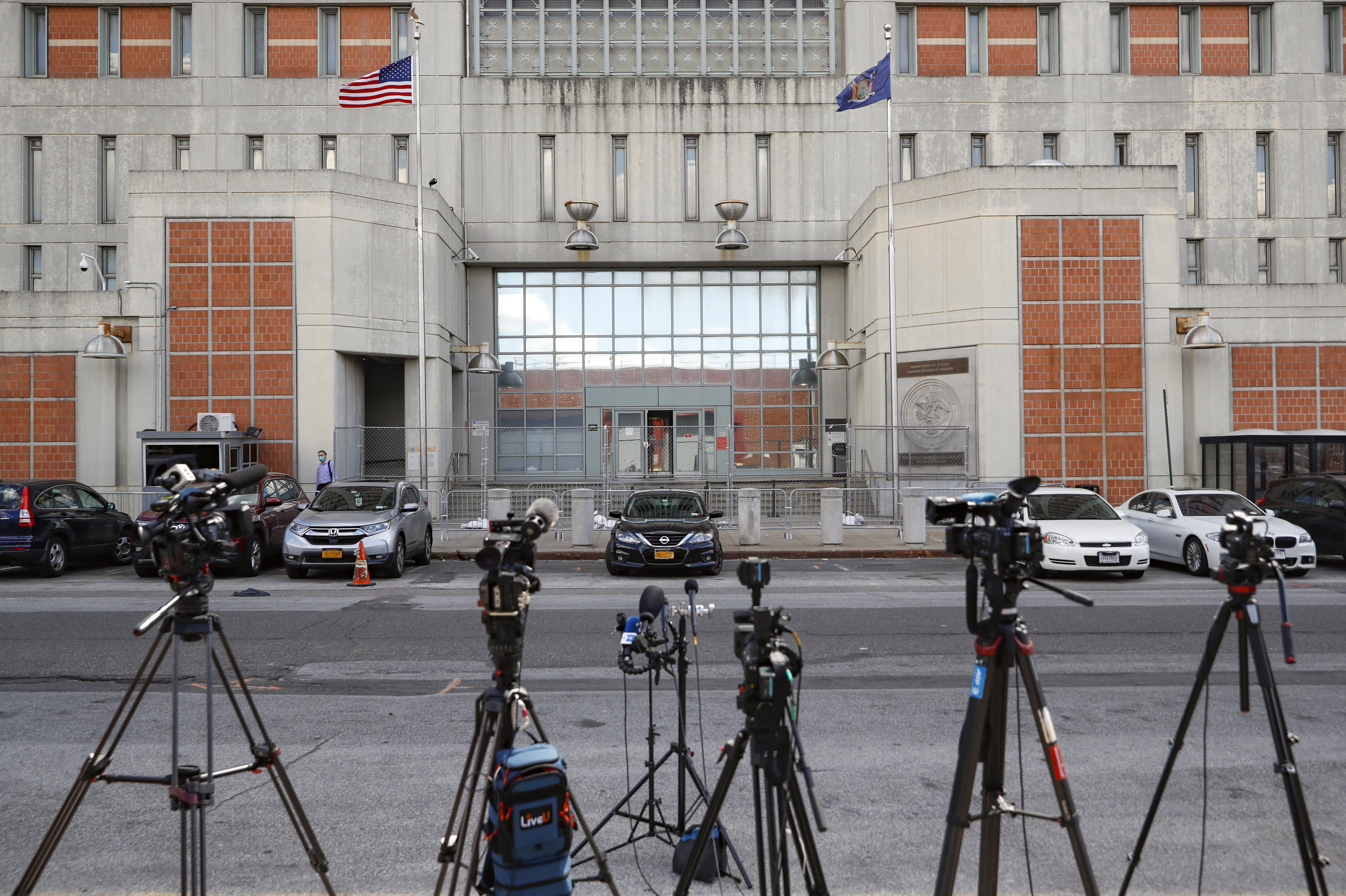 Media outlets set up cameras outside the main entrance of the Metropolitan Detention Center