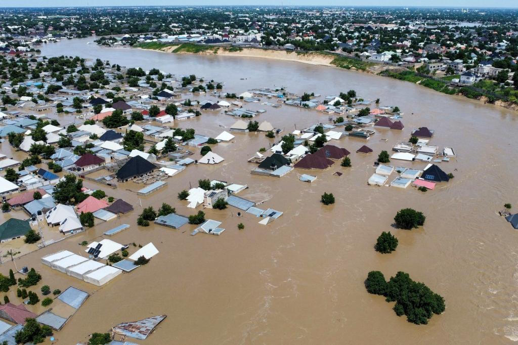 Houses are partially submerged following a dam collapse in Maiduguri.