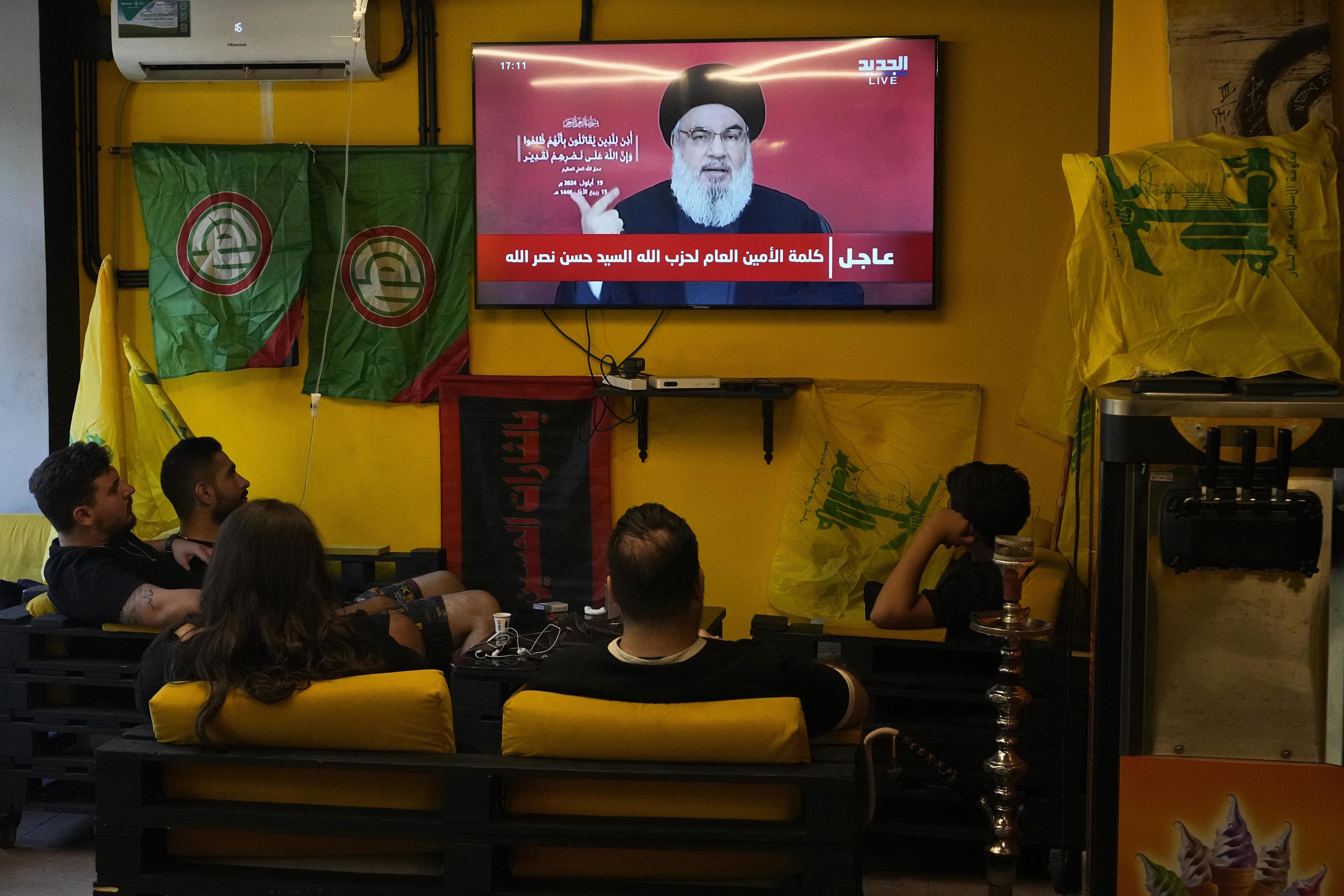 People watch the speech of Hezbollah leader Hassan Nasrallah.