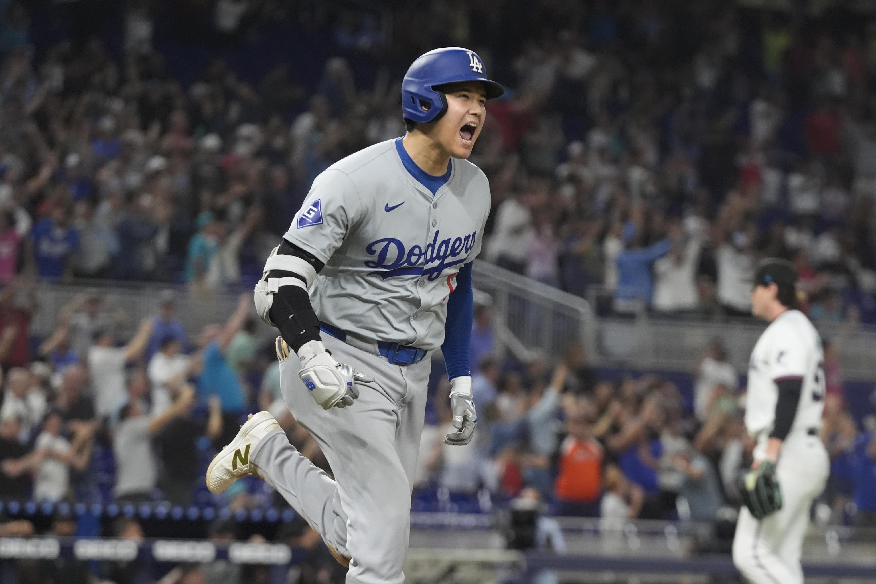 Los Angeles Dodgers' Ohtani (17) reacts after hitting his 50th home run.