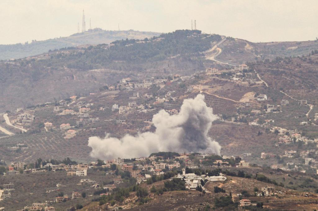 Smoke billows from the site of an Israeli airstrike on Lebanon's village.