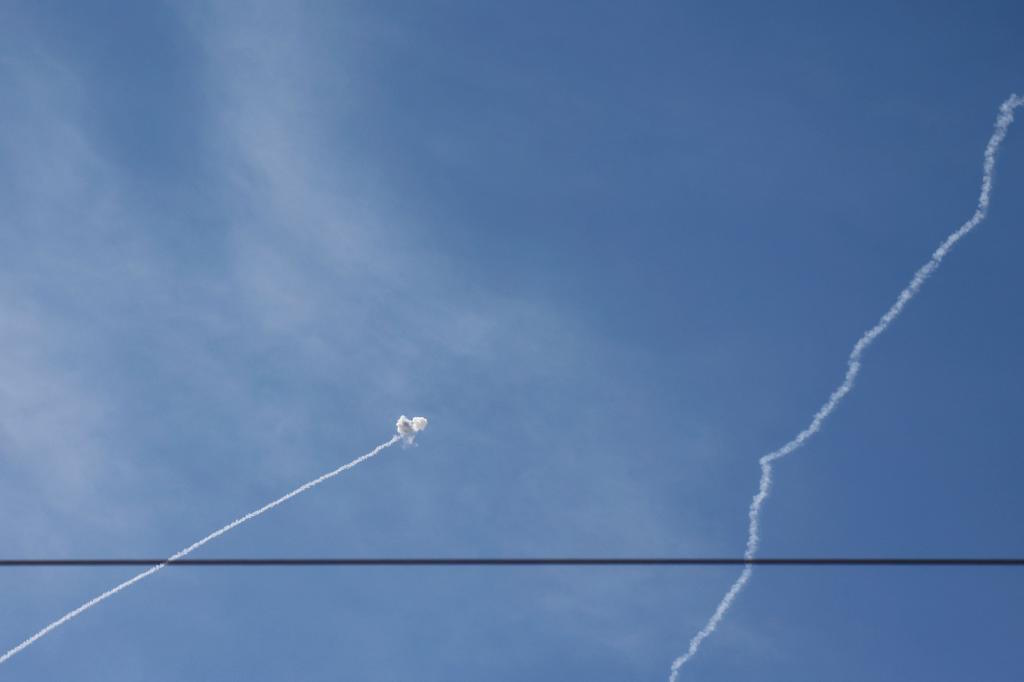 Rockets are intercepted by Israel's air defence system.