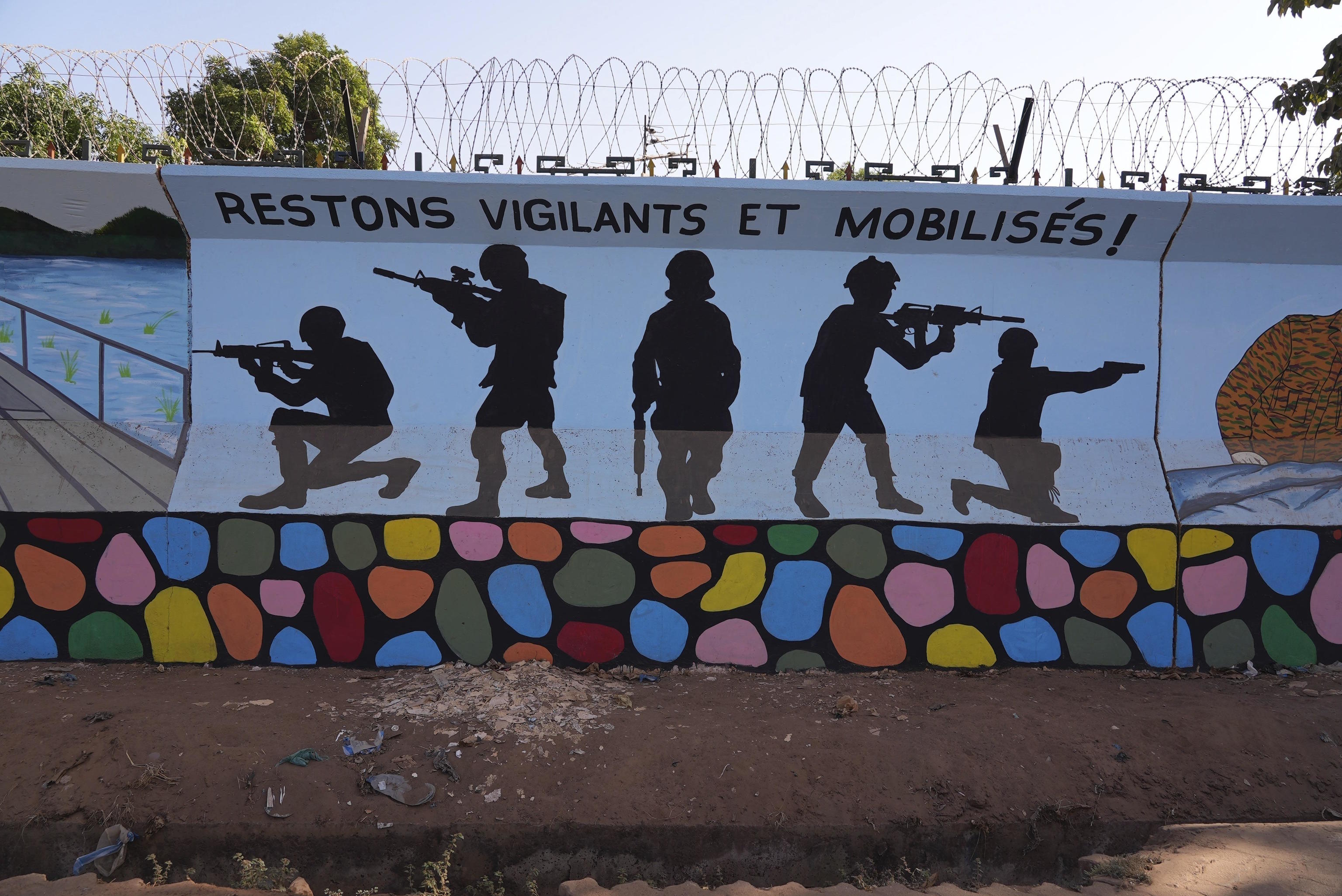 A mural reading "remain vigilant and mobilised" is seen in Ouagadougou, Burkina Faso.