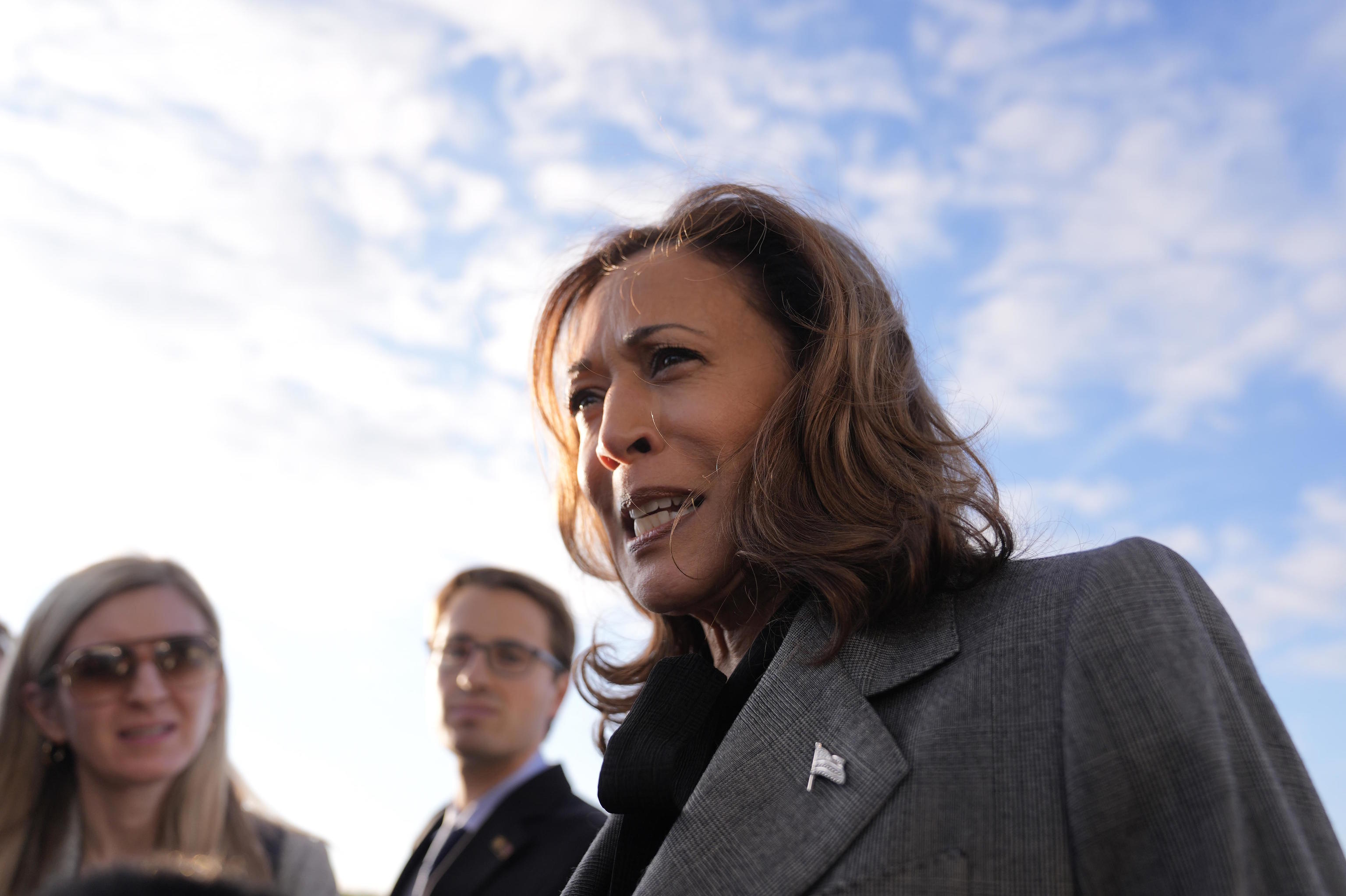 Kamala Harris speaks to reporters upon arrival at Andrews Air Force Base.