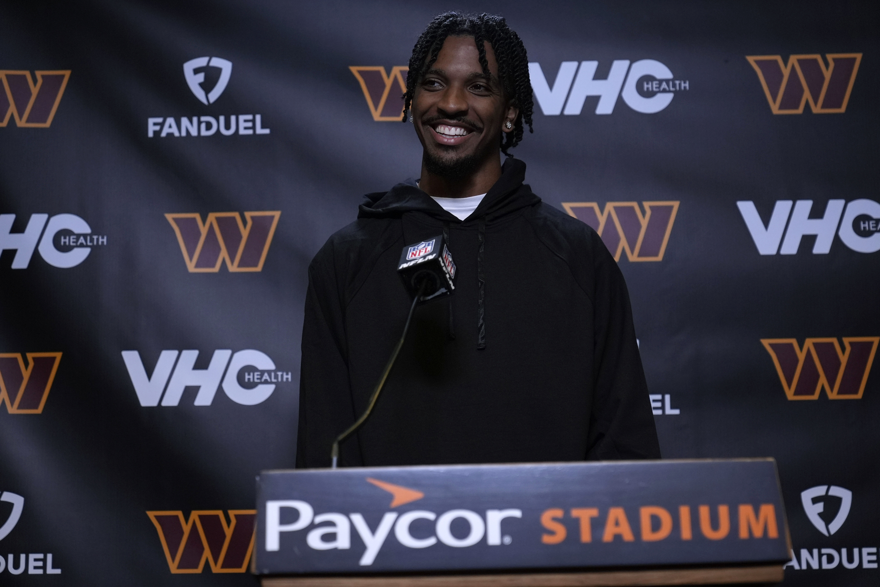 Washington Commanders quarterback Jayden Daniels speaks during a news conference.