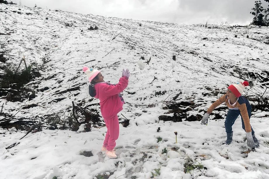 Two children playing in the snow in South Africa.