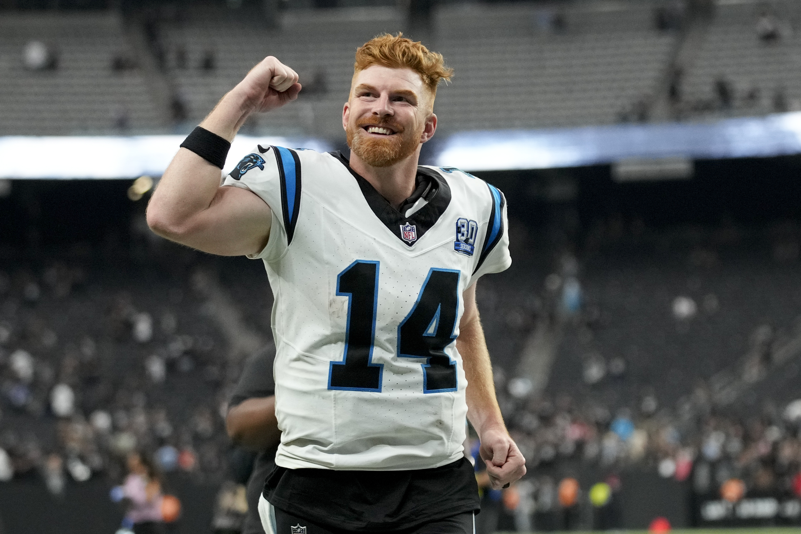 Carolina Panthers quarterback Andy Dalton celebrates after their win against the Las Vegas Raiders.