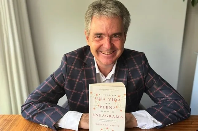 Roberto Whyte poses with his new book.