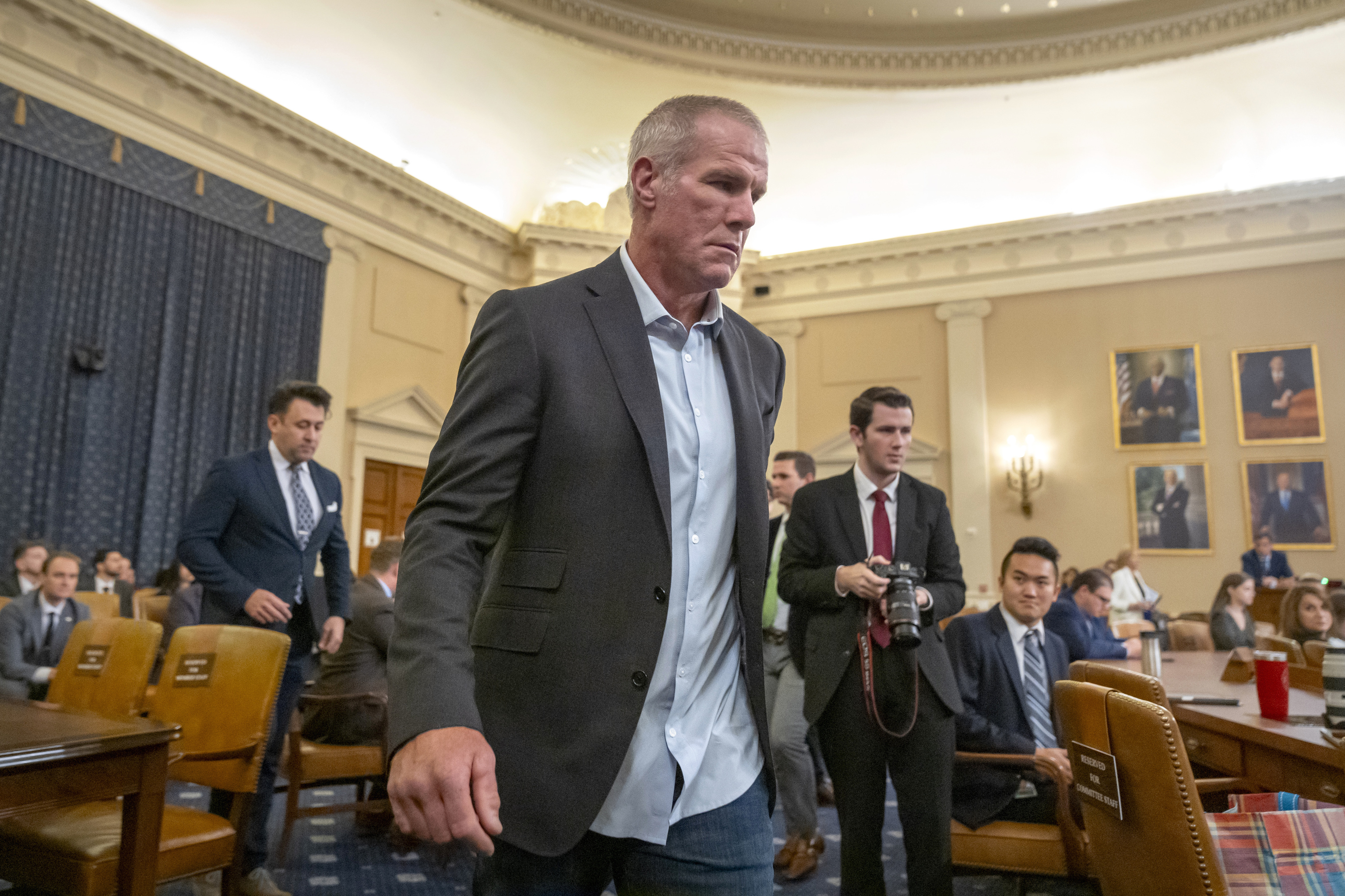 Former NFL quarterback Brett Favre arrives to appear before the House Committee on Ways and Means on Capitol Hill.