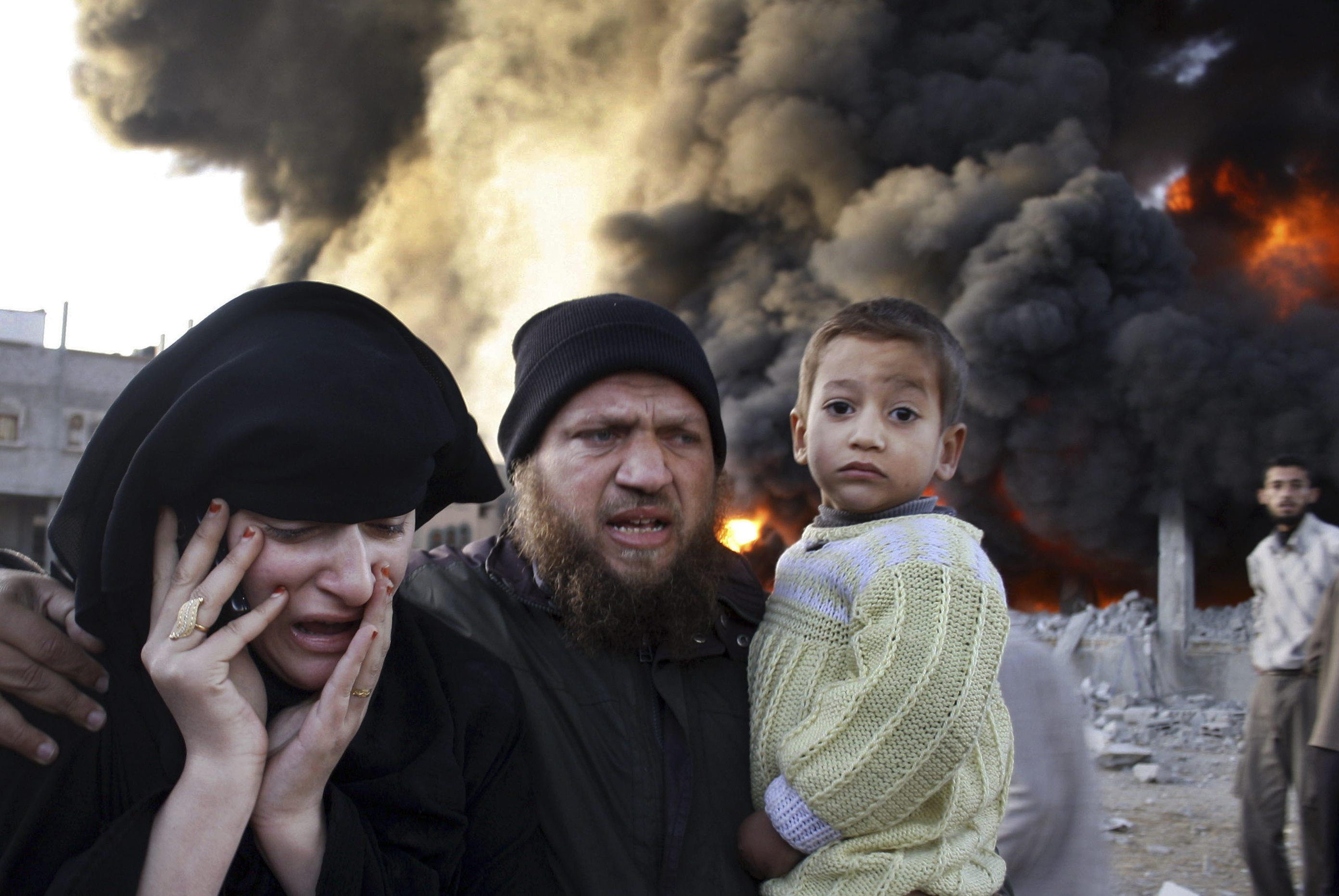 A Palestinian family reacts after an Israeli missile strike in Rafah.