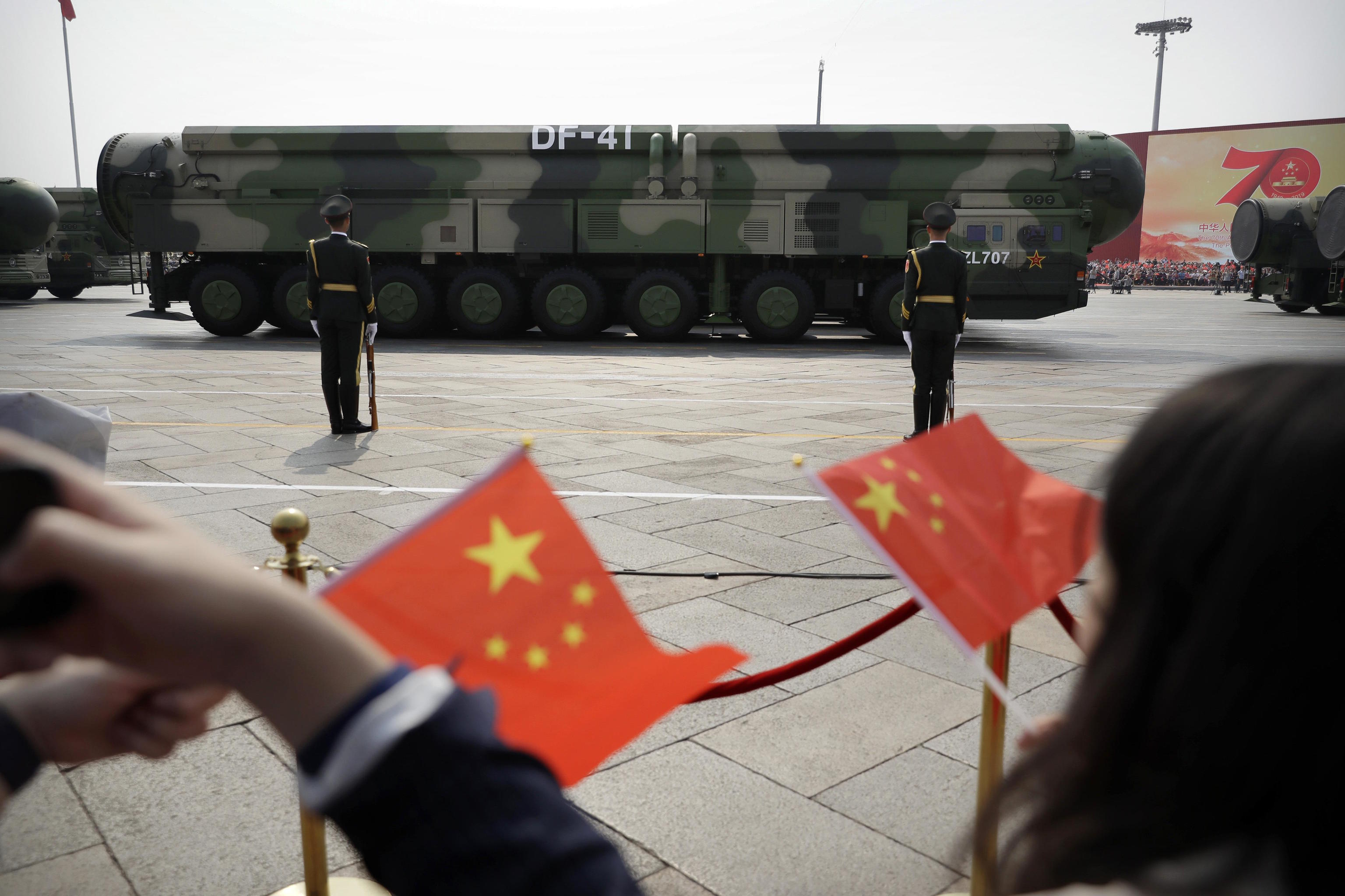 Nuclear ballistic missiles roll during a parade.