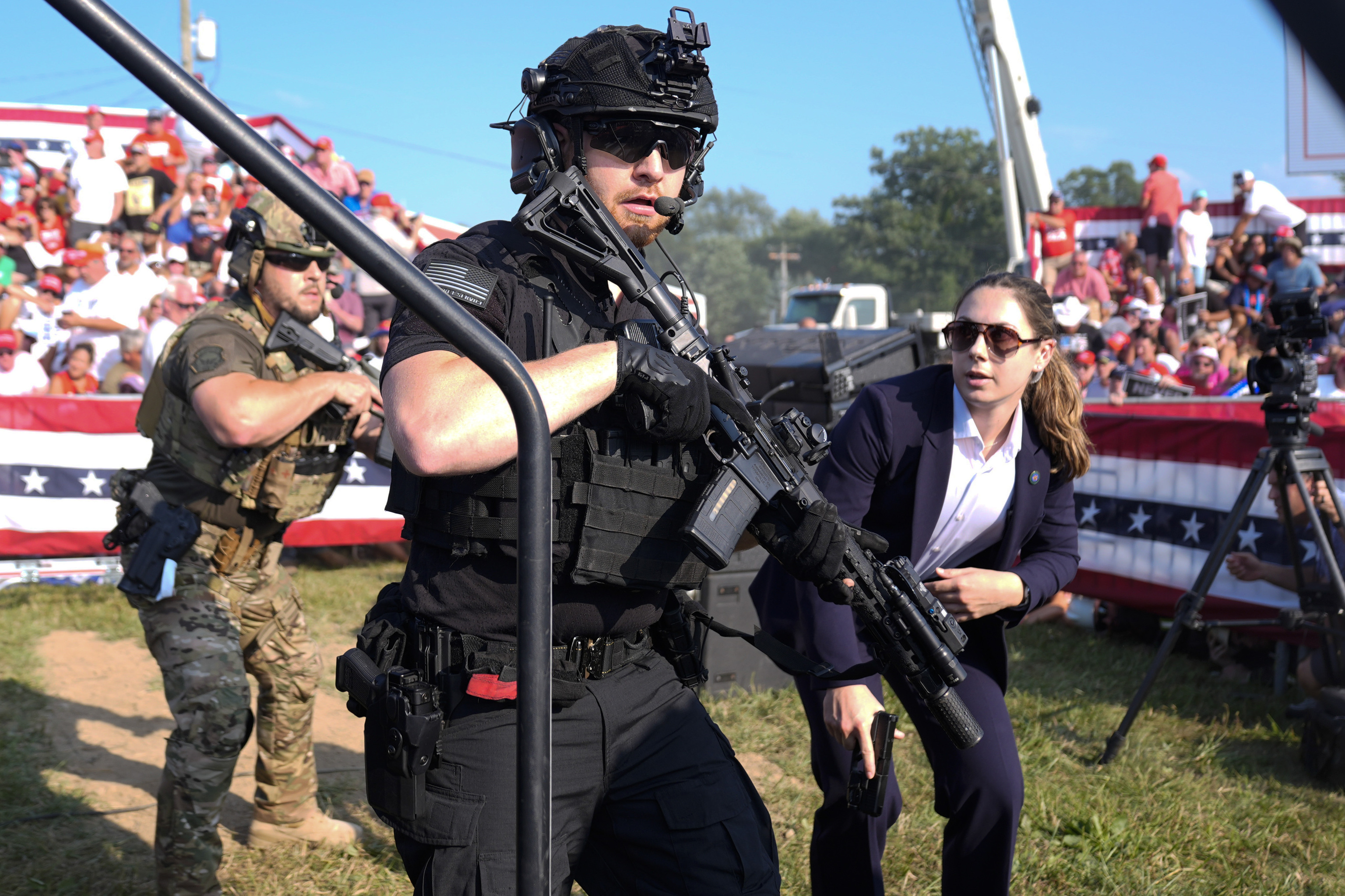 US Secret Service agents react as Republican candidate for the White House, former President Donald Trump, is named as a candidate for the presidency.