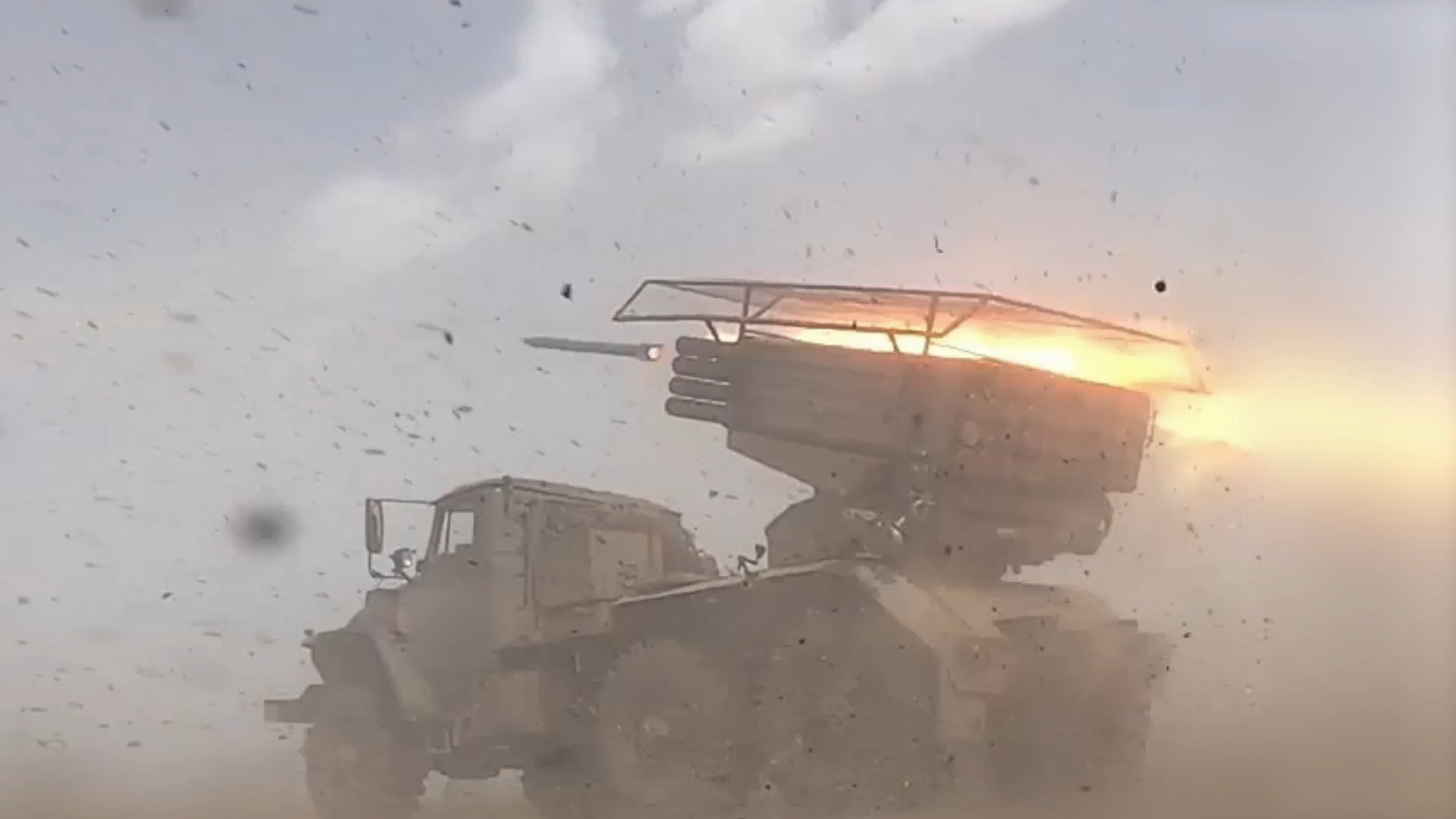 A Russian BM-21 Grad self-propelled 122 mm multiple rocket launcher fires on an undisclosed location in Ukraine