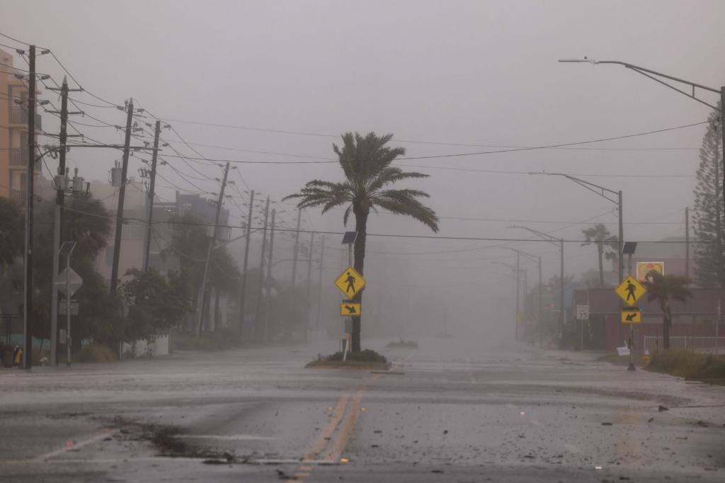 A road is empty of traffic as Hurricane Helene churns offshore in Florida.