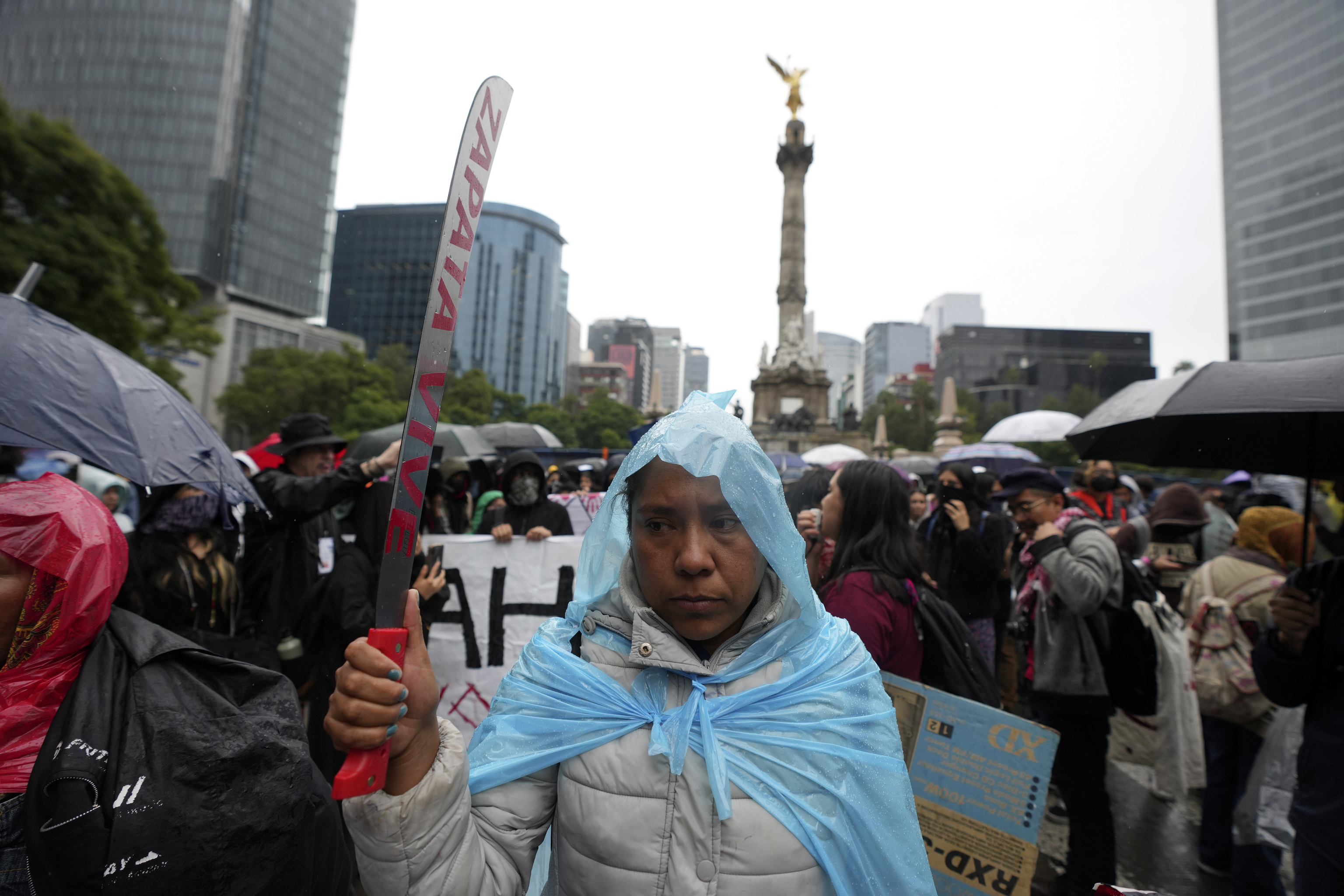 Families and friends take part in a demonstration marking the 10-year anniversary of the disappearance of 43 students