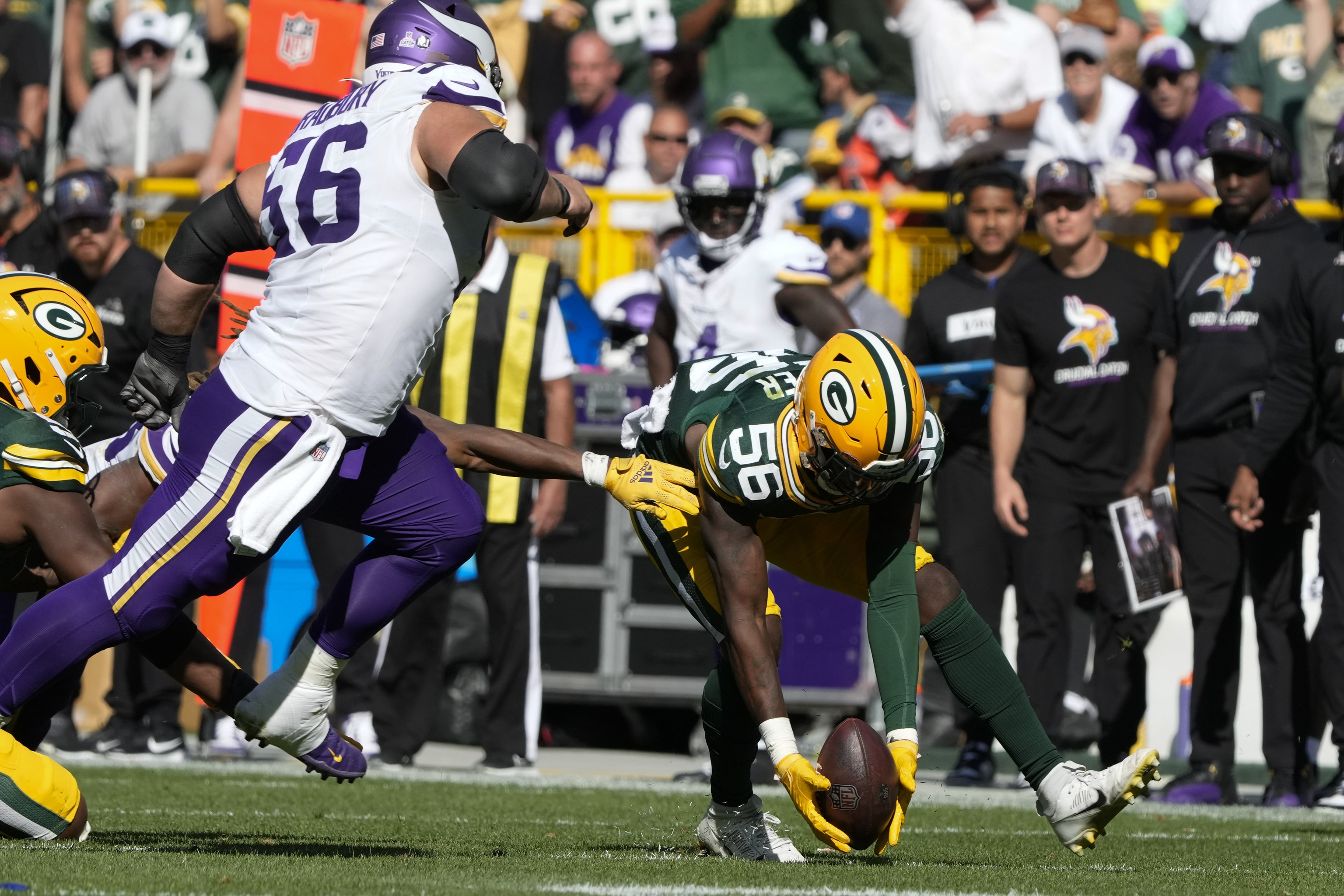 Green Bay Packers linebacker Edgerrin Cooper (56) recovers a fumble by the Minnesota Vikings