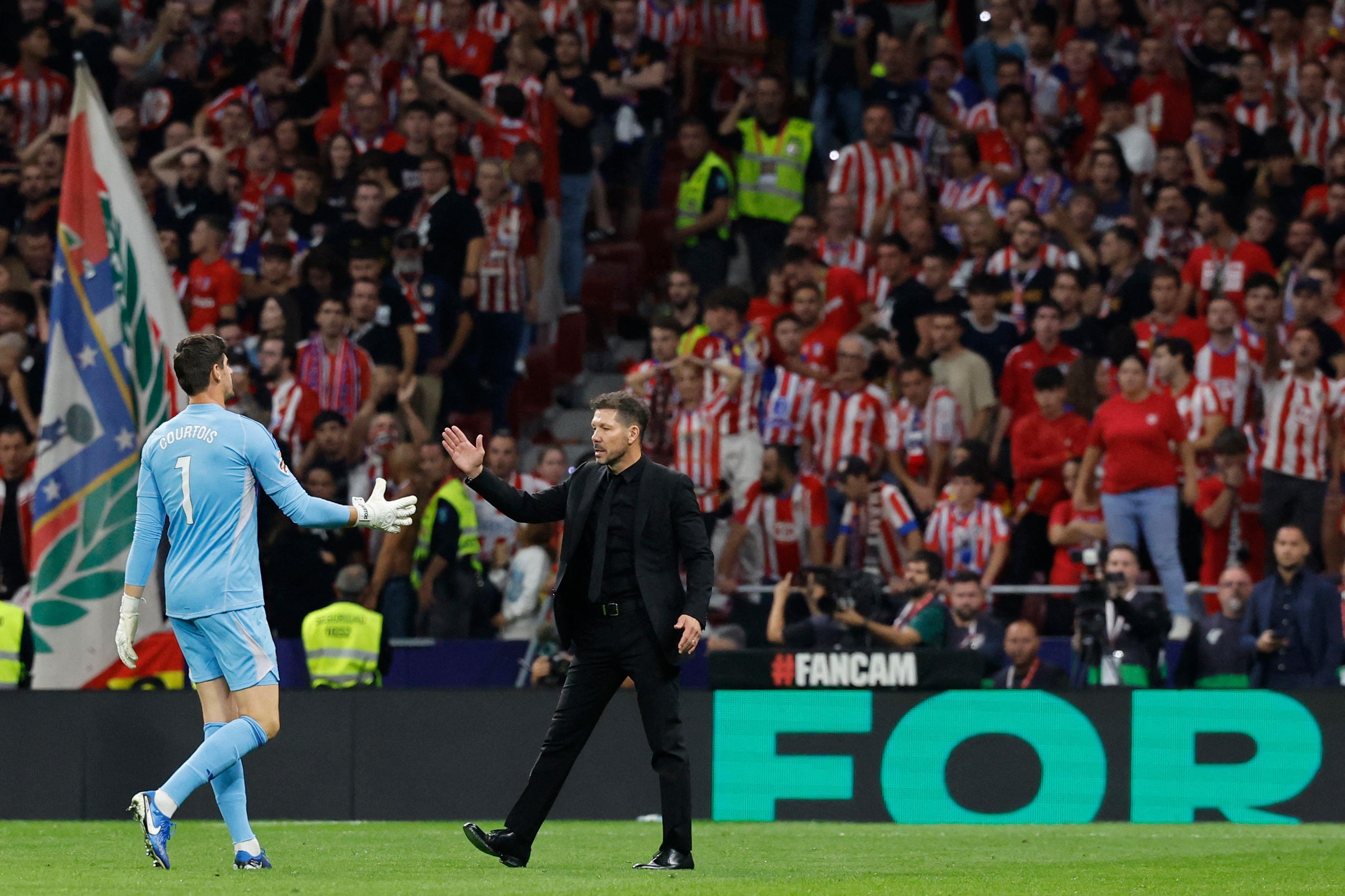 Courtois with Simeone.