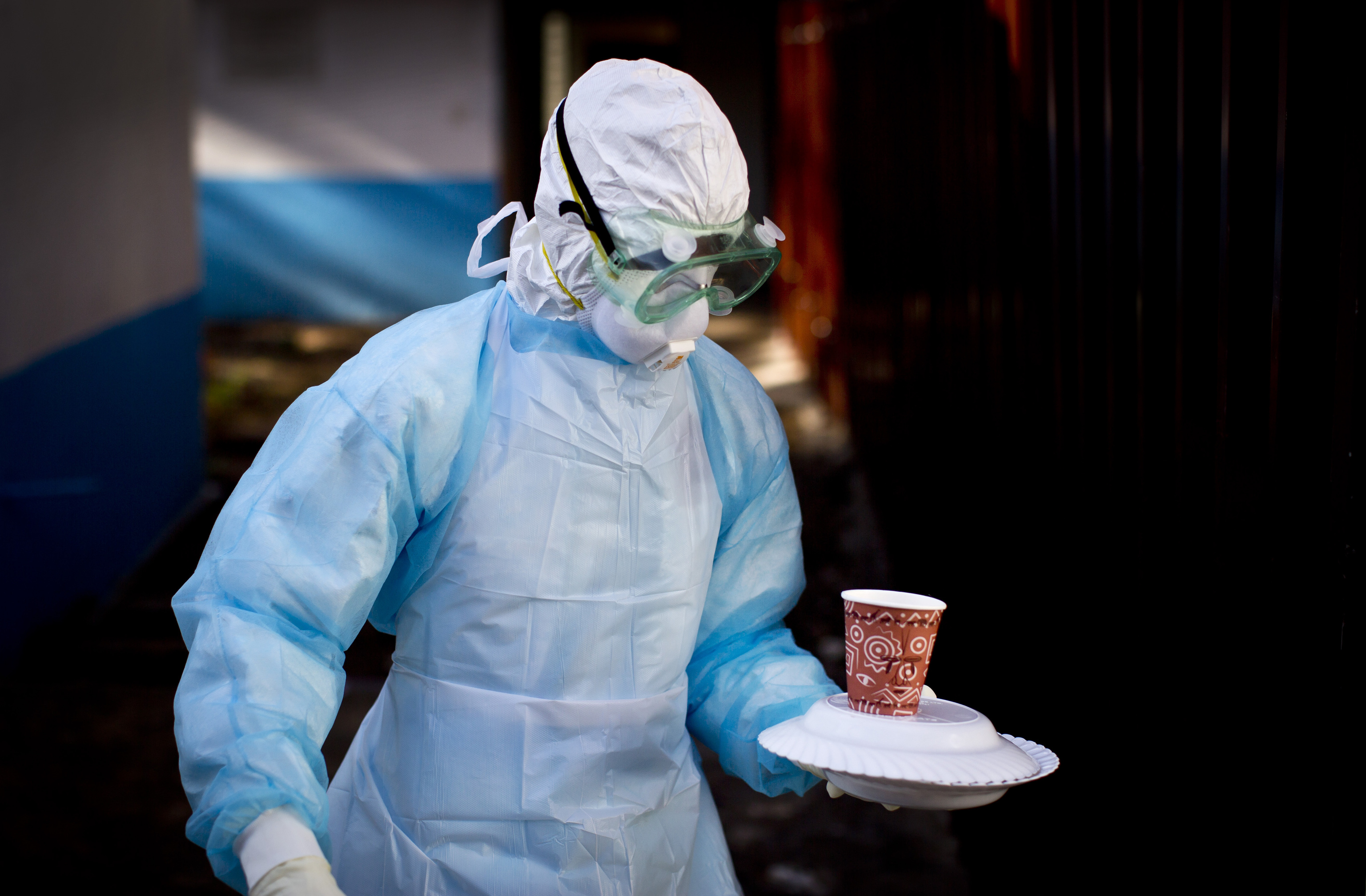 a medical worker from the Infection Prevention and Control unit wearing full protective equipment