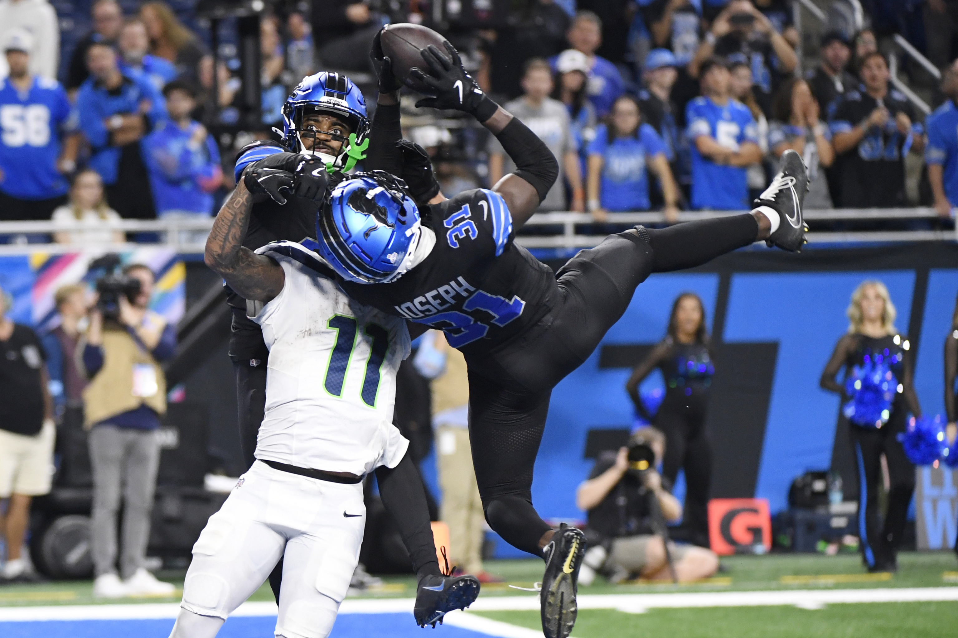 Detroit Lions safety Kerby Joseph (31) intercepts the ball intended for Seattle Seahawks