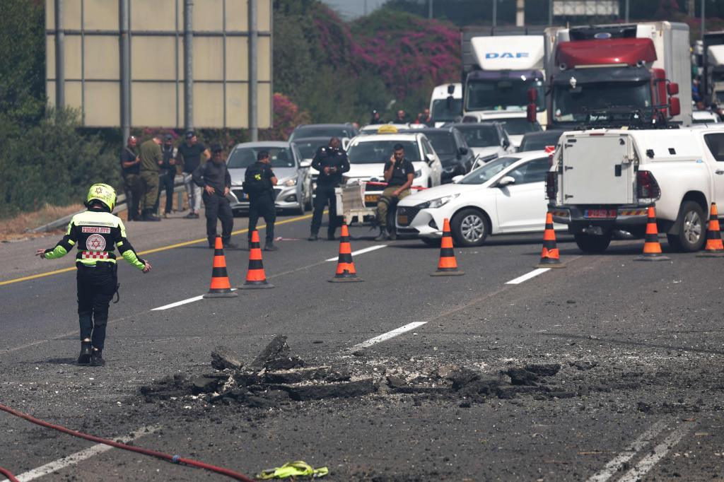 Israeli emergency deploy at the impact site of a reported rocket fired.