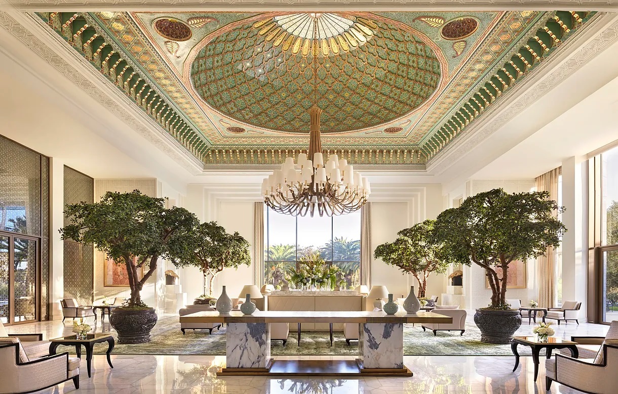 The lobby, with bonsai trees and a chandelier.