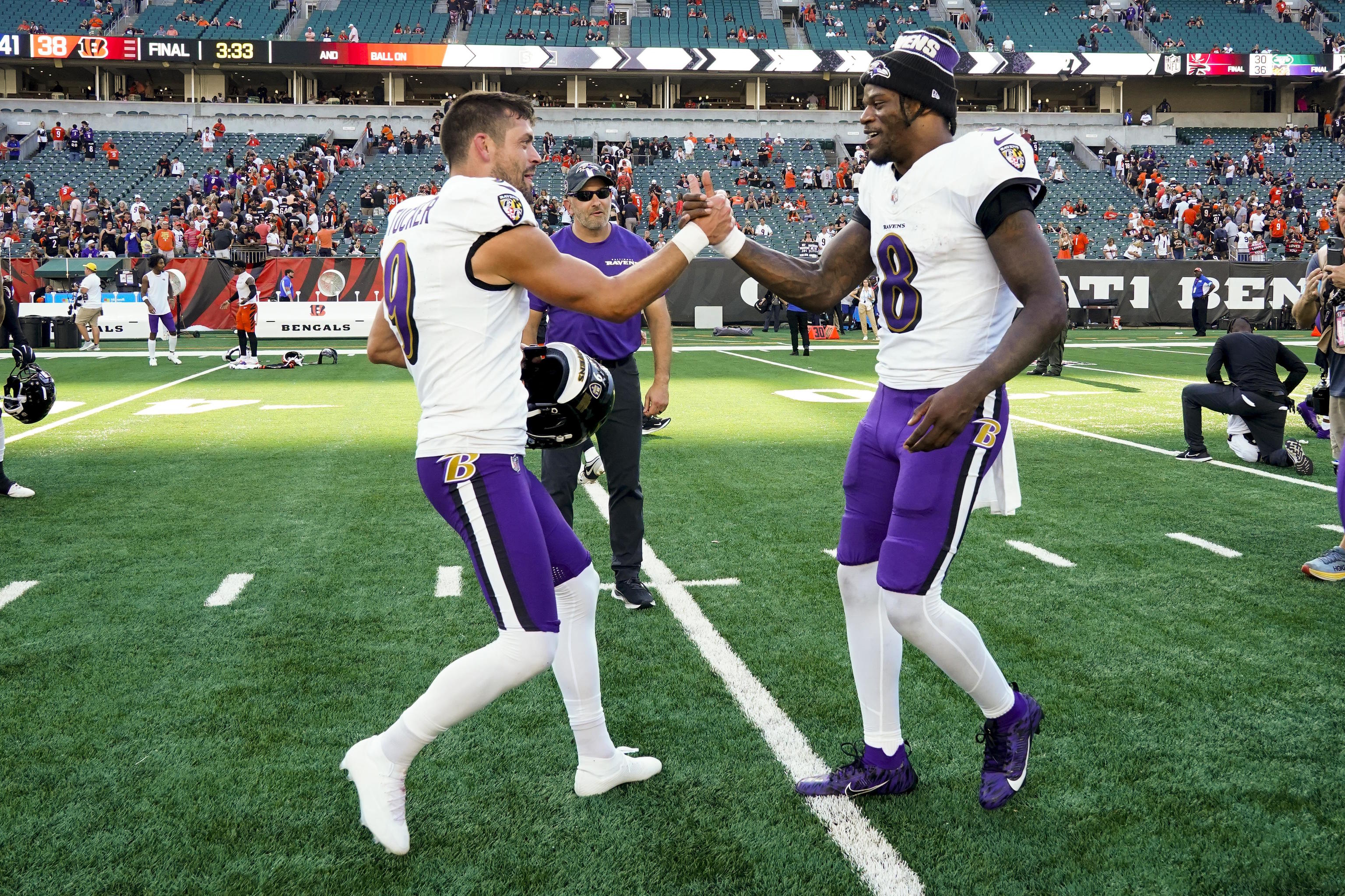 Baltimore Ravens kicker Justin Tucker, left, and quarterback Lamar Jackson.