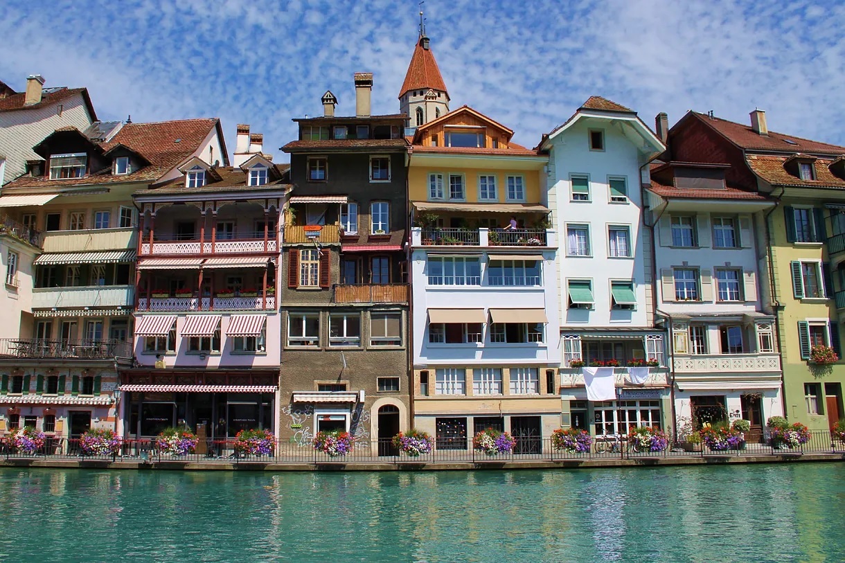 The town between lakes features traditional houses and a cozy atmosphere.