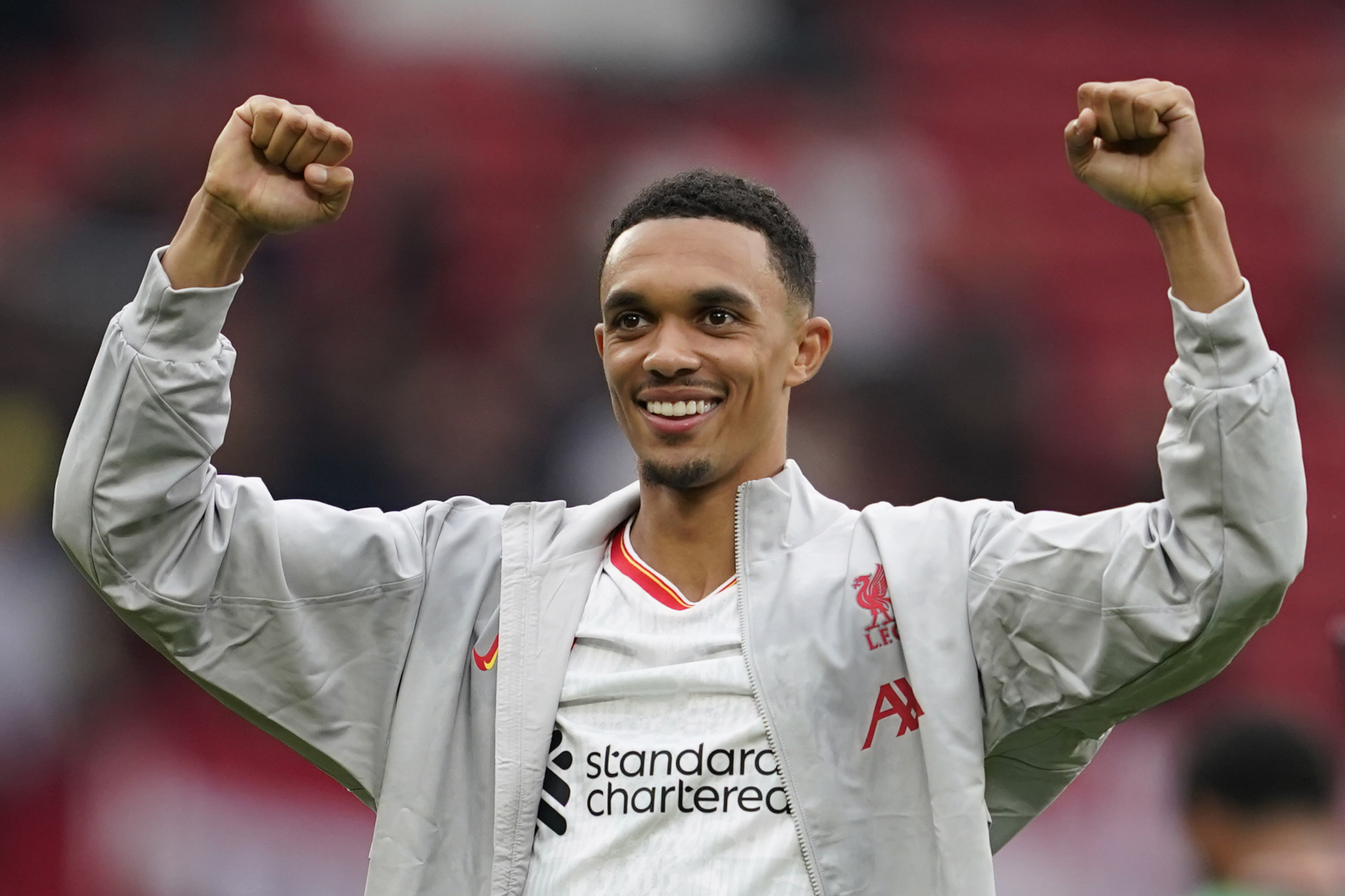 Liverpool's Trent Alexander-Arnold celebrates their victory at the English Premier League.