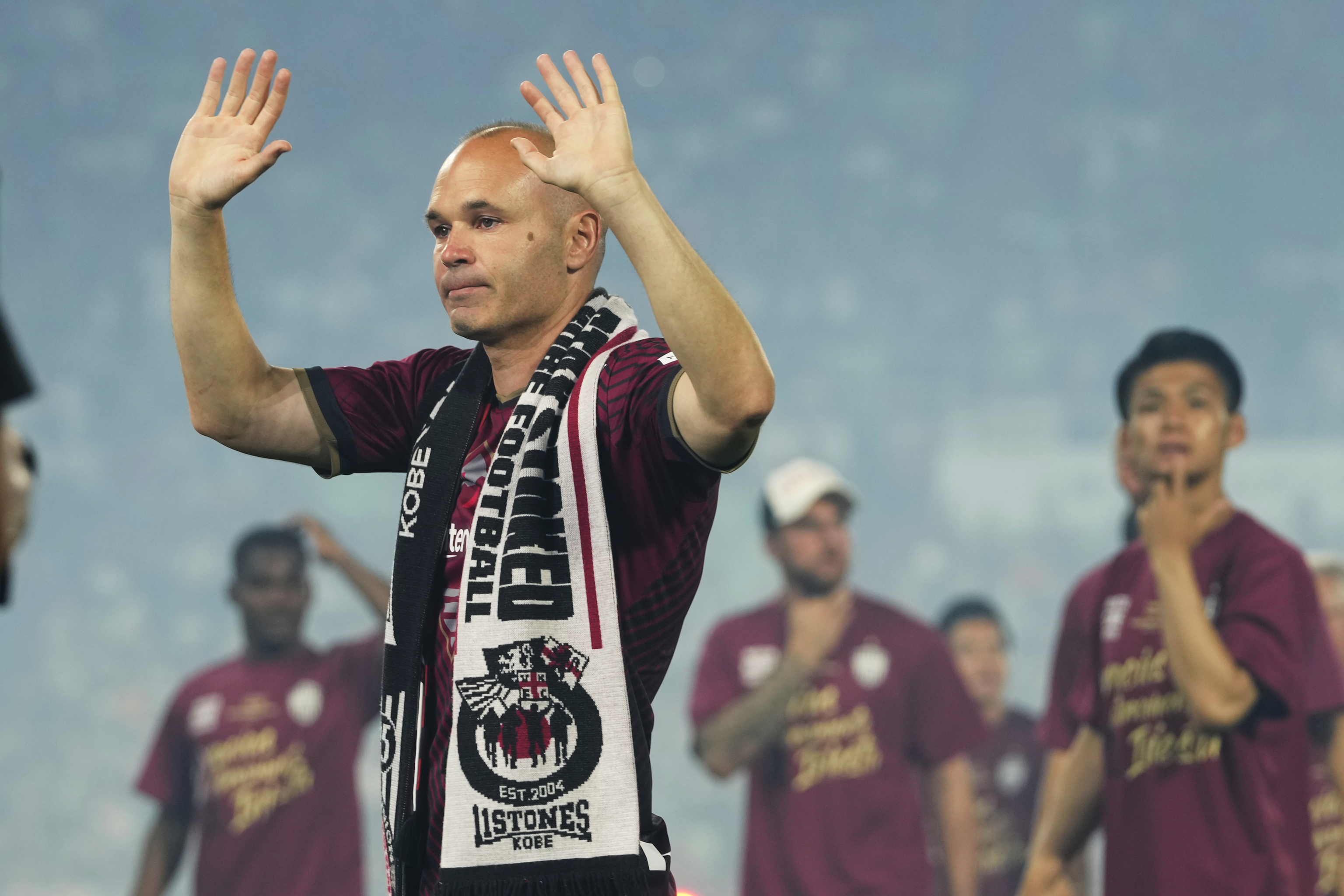 Vissel Kobe midfielder Andres Iniesta waves towards audience members at the end of a farewell ceremony to commemorate his leaving the club