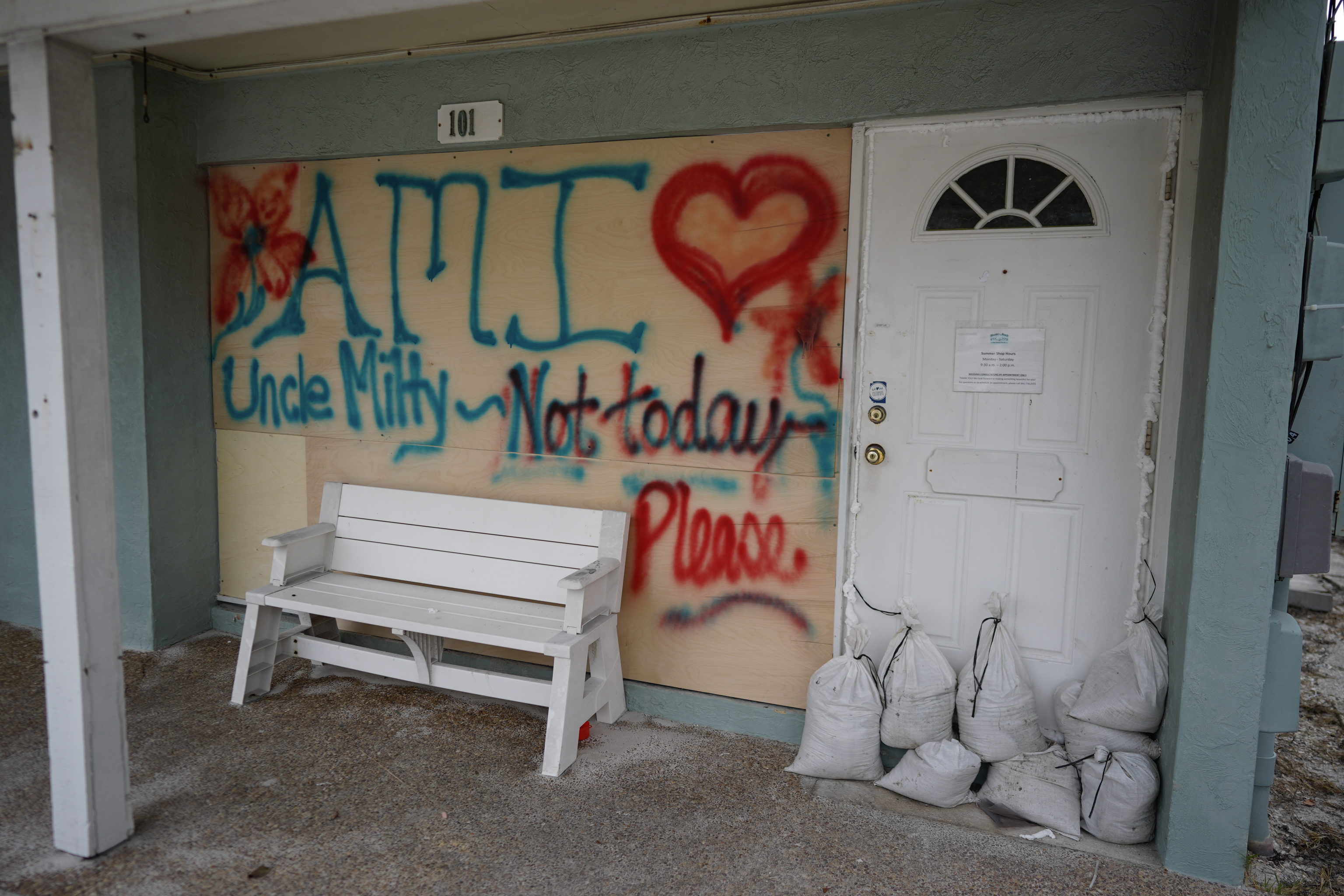 Boards on the window of a store display a message ahead of the arrival of Hurricane Milton.