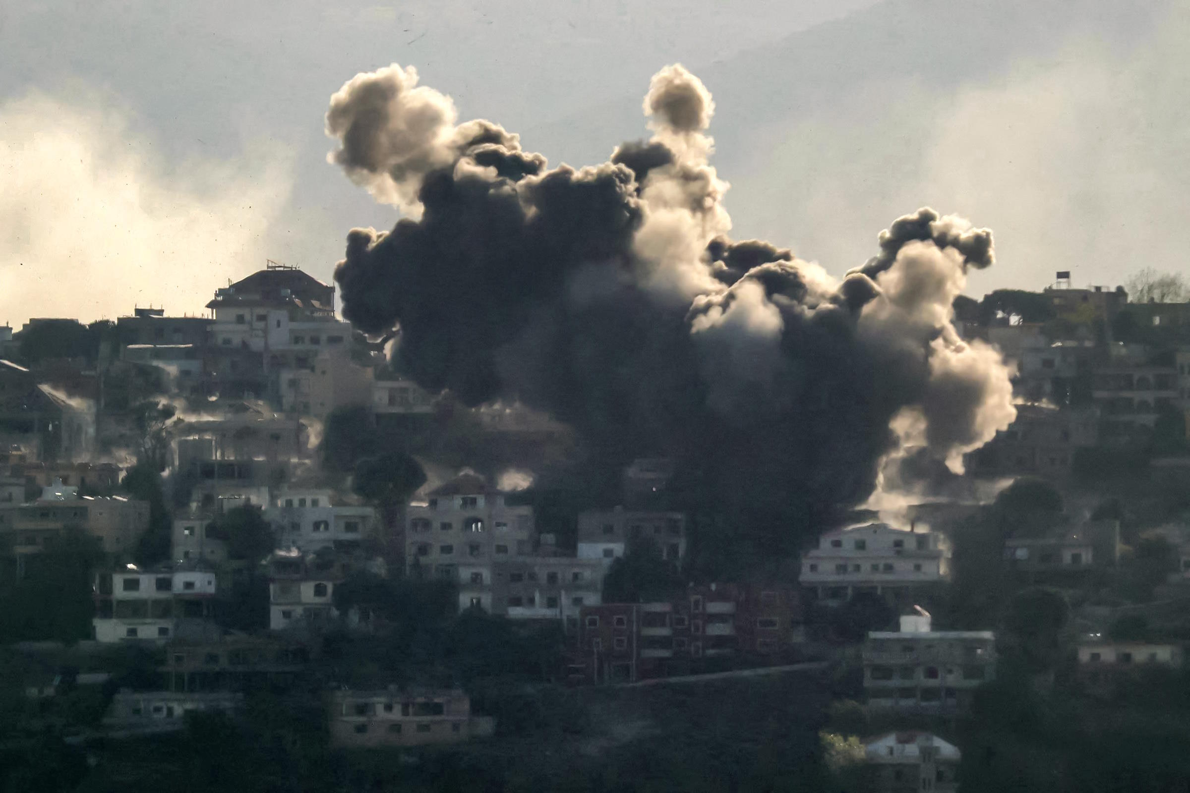 Smoke rises from the site of an Israeli air strike in Lebanese village of Khiam.