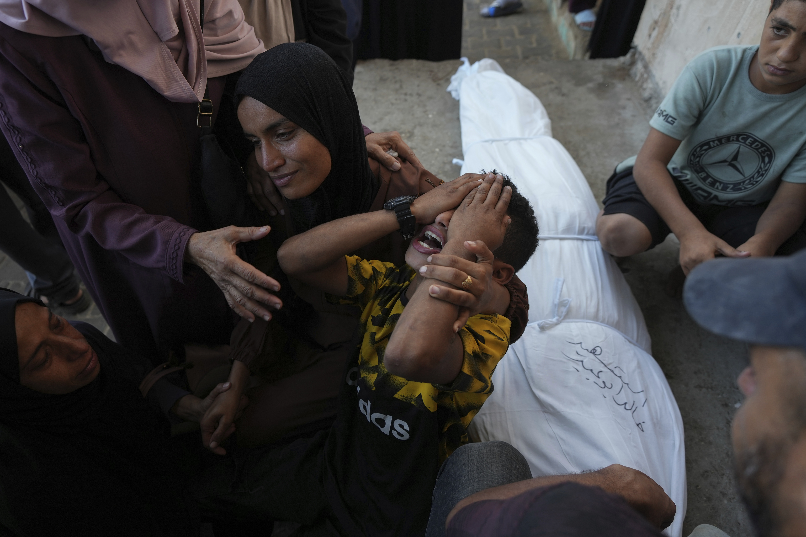 Mourners attend the funeral of Palestinians killed in the Israeli bombardment of the Gaza Strip