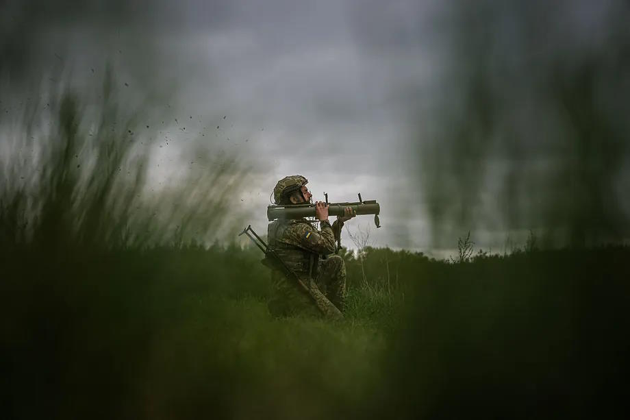 A Ukrainian soldier fires a rocket during training.