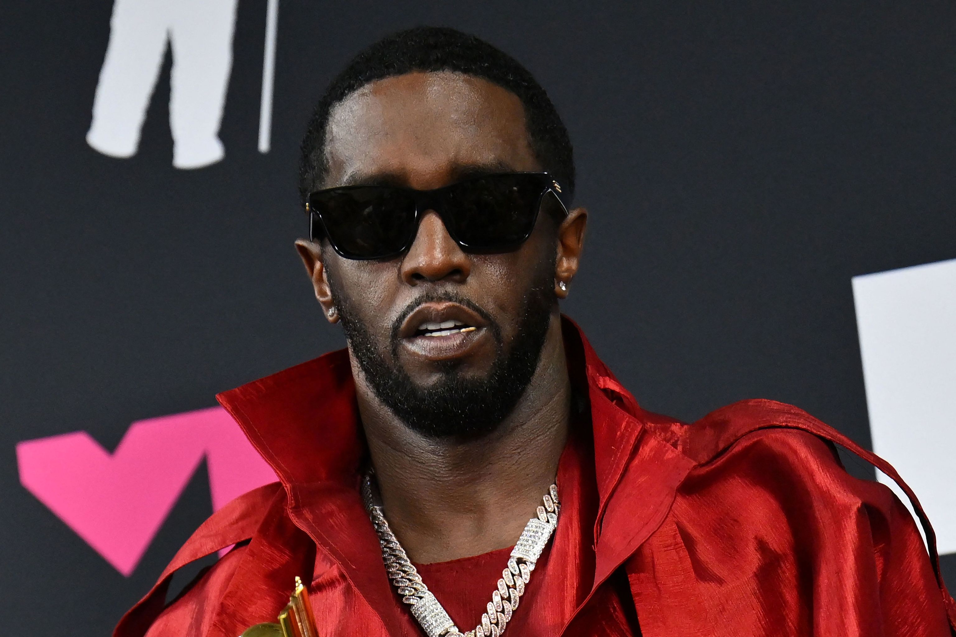 US producer-musician Sean "Diddy" poses with the Global Icon award in the press room during the MTV Video Music Awards at the Prudential Center in Newark, New Jersey, on September 12, 2023.