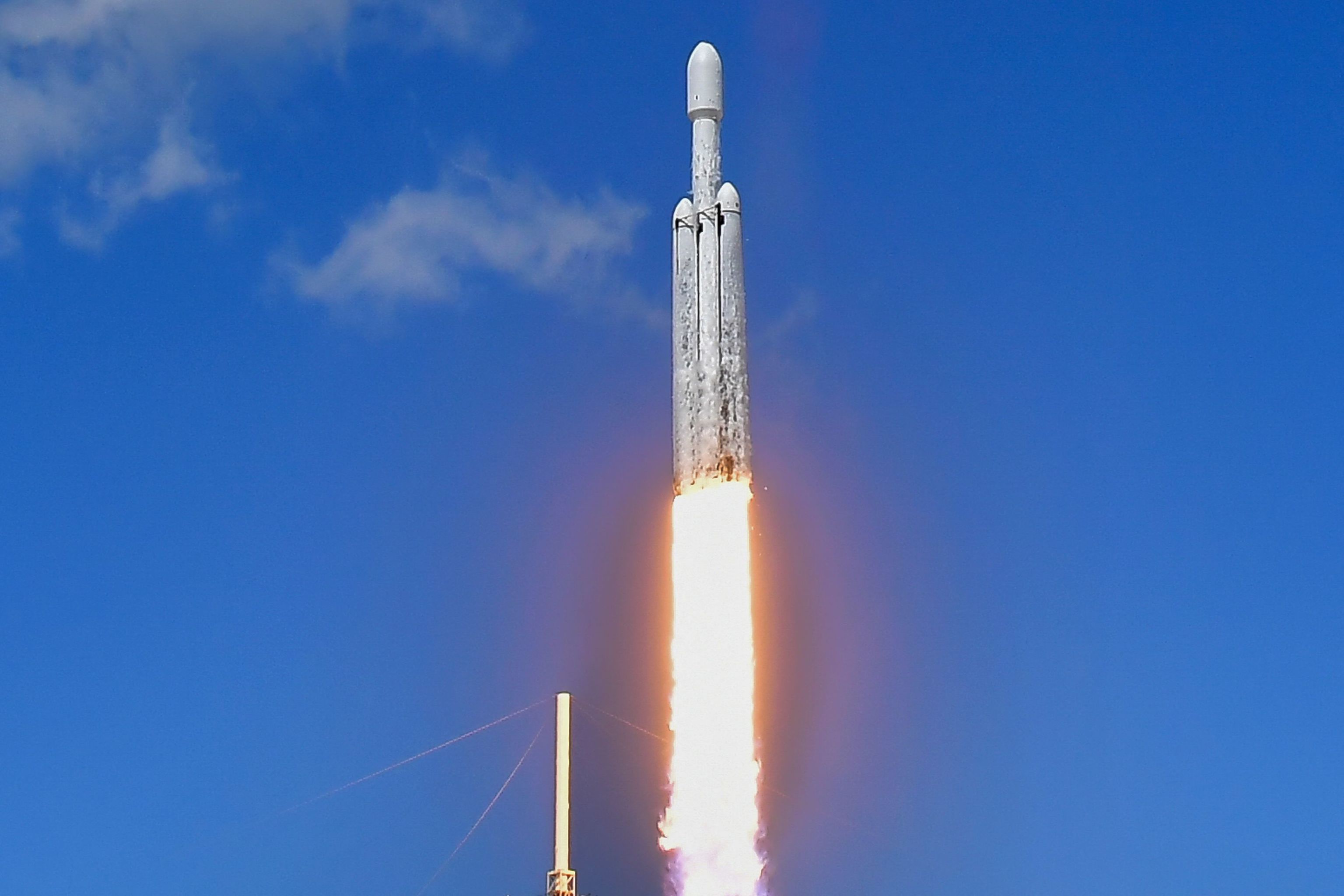 A SpaceX Falcon Heavy rocket with the Europa Clipper spacecraft aboard launches.