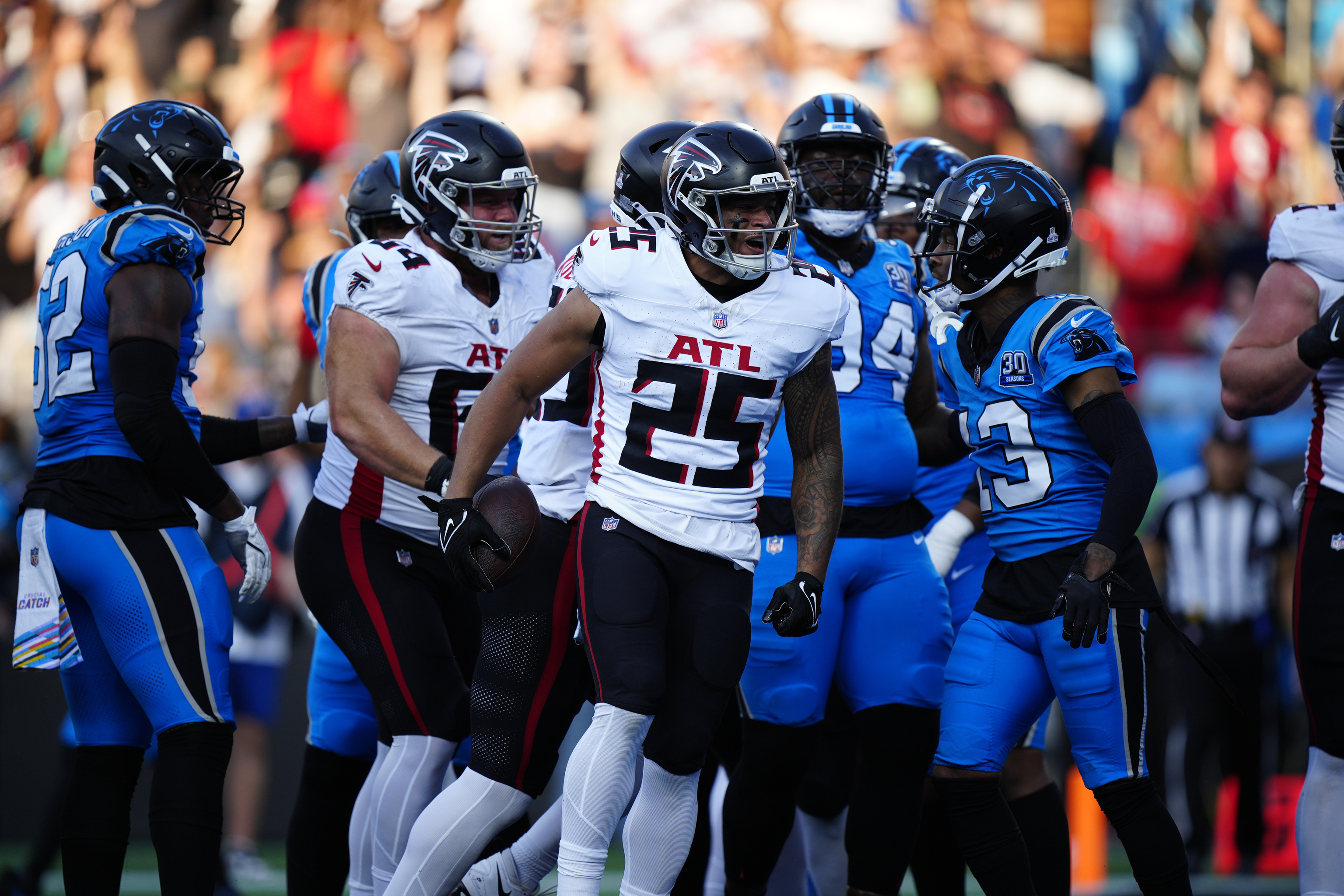 Atlanta Falcons running back Tyler Allgeier (25) celebrates after running in a a 2-point conversion.