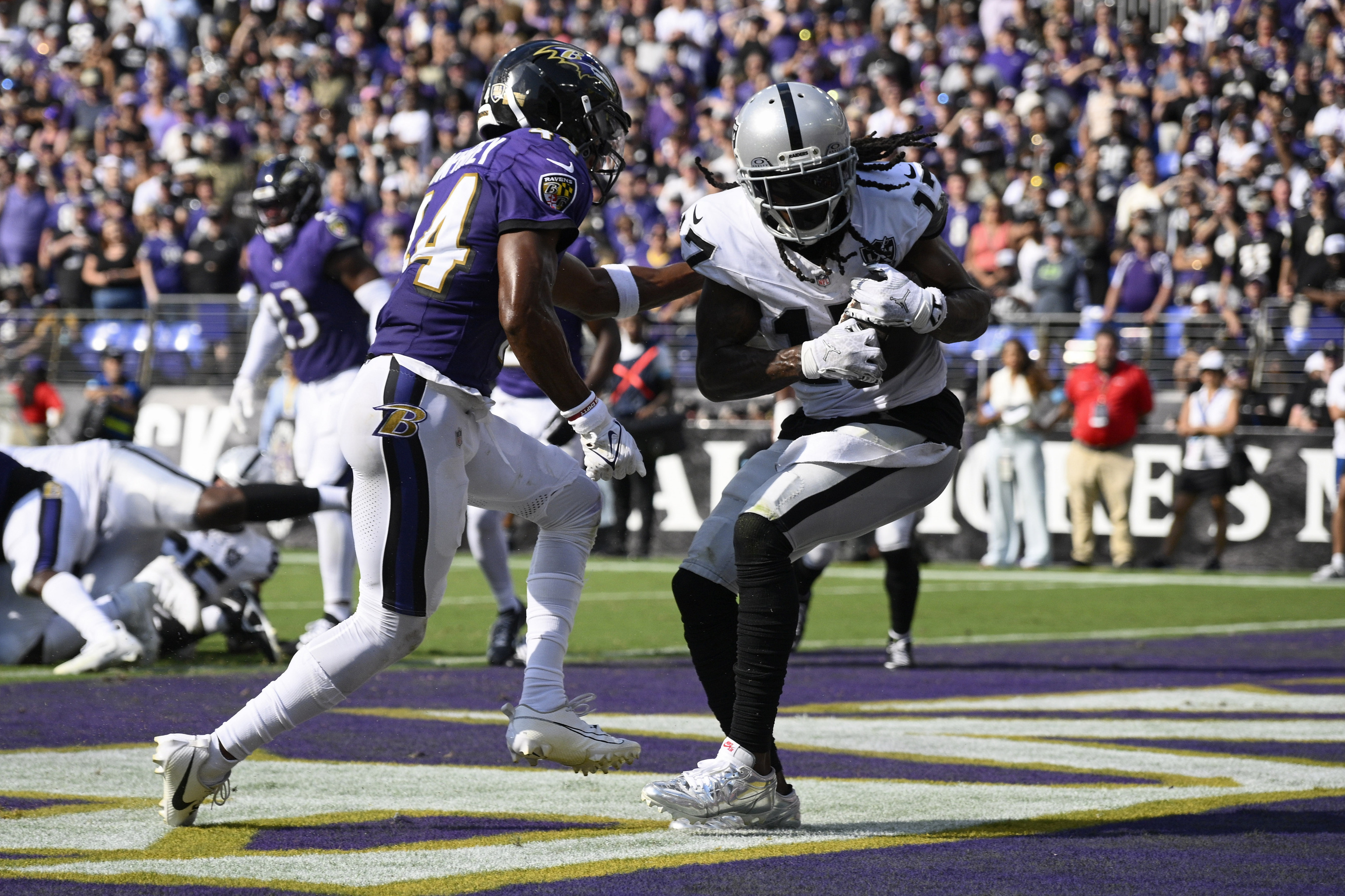 Las Vegas Raiders wide receiver Davante Adams (17) catches a touchdown pass against Baltimore Ravens.