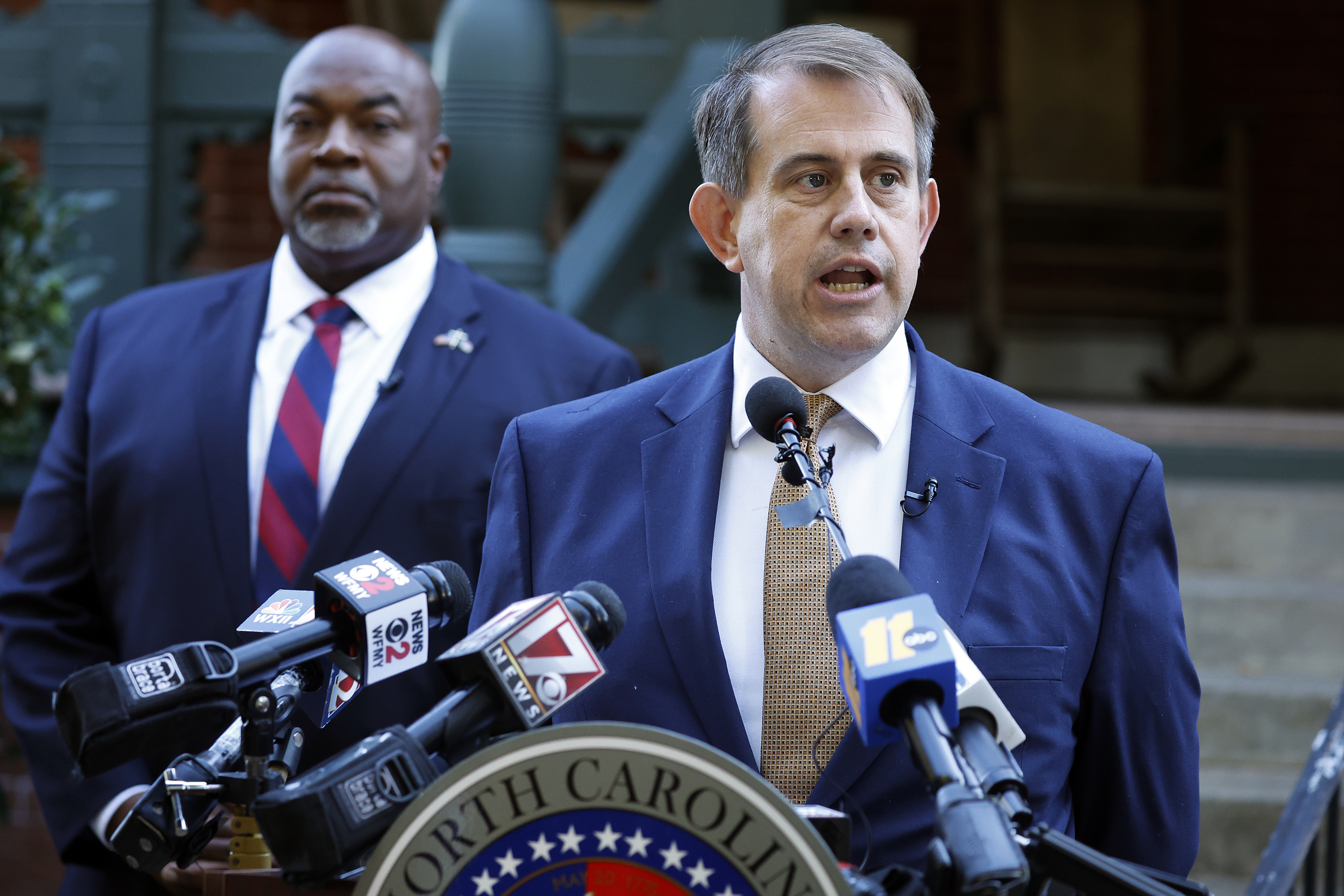 Attorney Jesse Binnall, right, speaks at a news conference, with his client North Carolina Lt. Gov. Mark Robinson, left