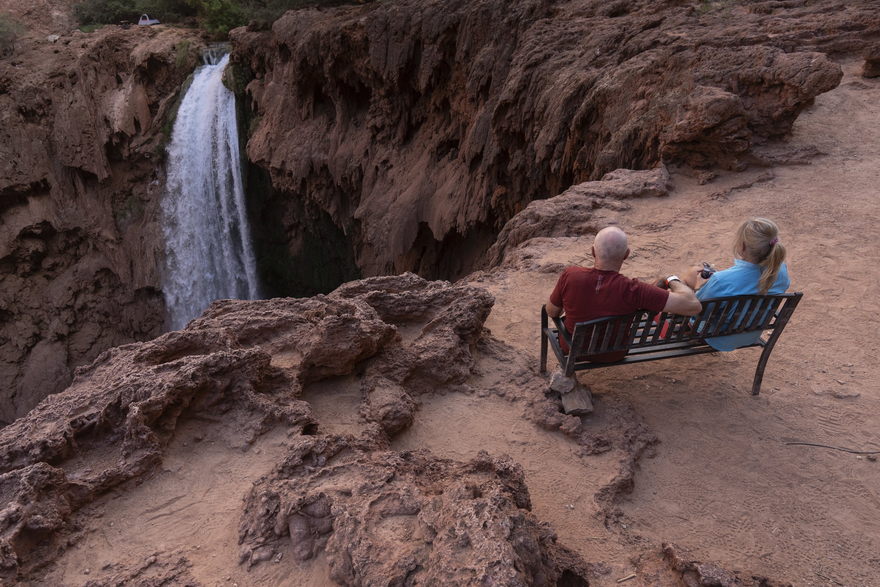 A family relaxes near the Havasupai Falls in the Grand Canyon in northern Arizona