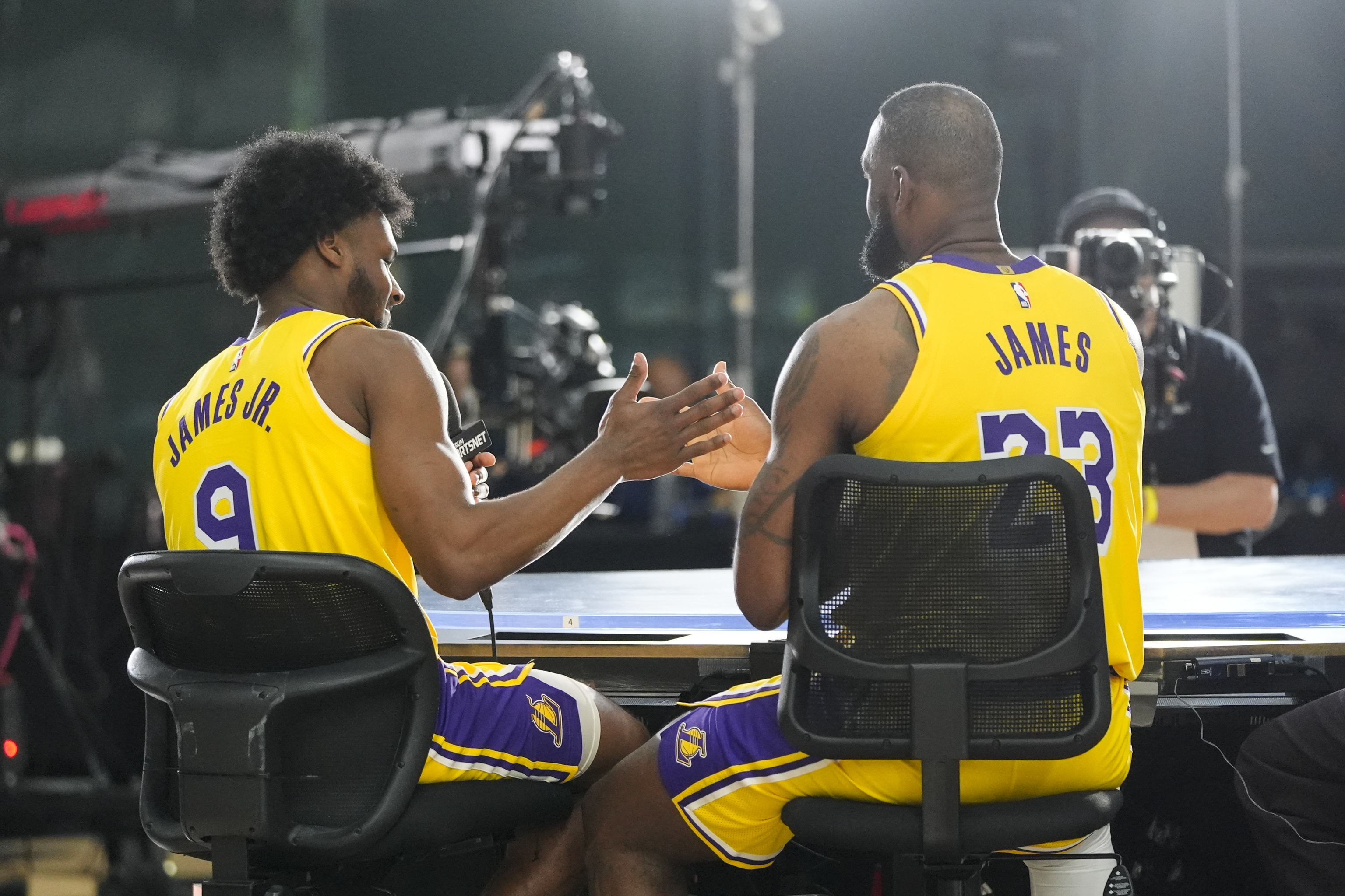 Los Angeles Lakers' LeBron James, right, and his son, Bronny James