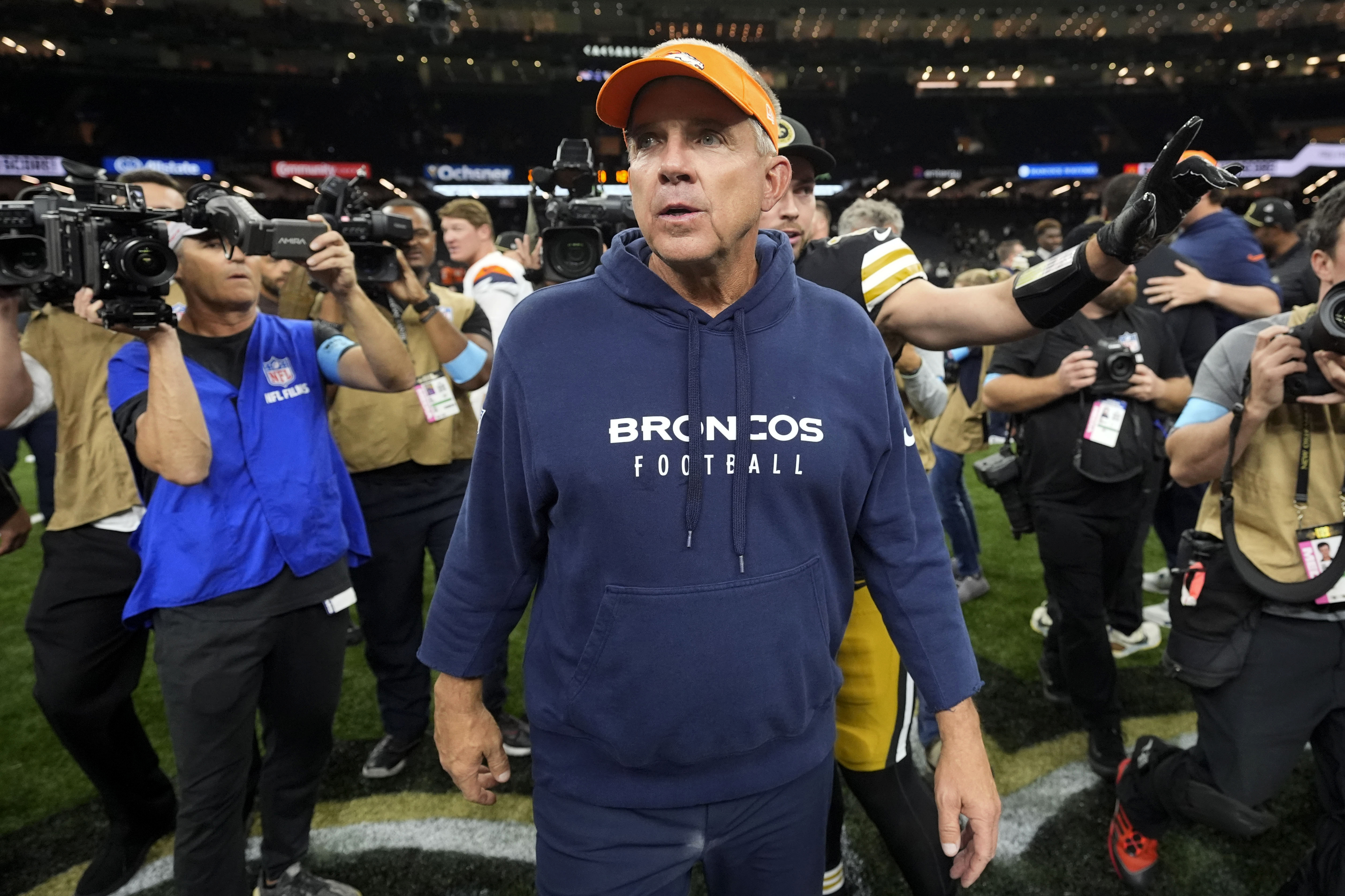 Denver Broncos head coach Sean Payton walks off the field after an NFL football game