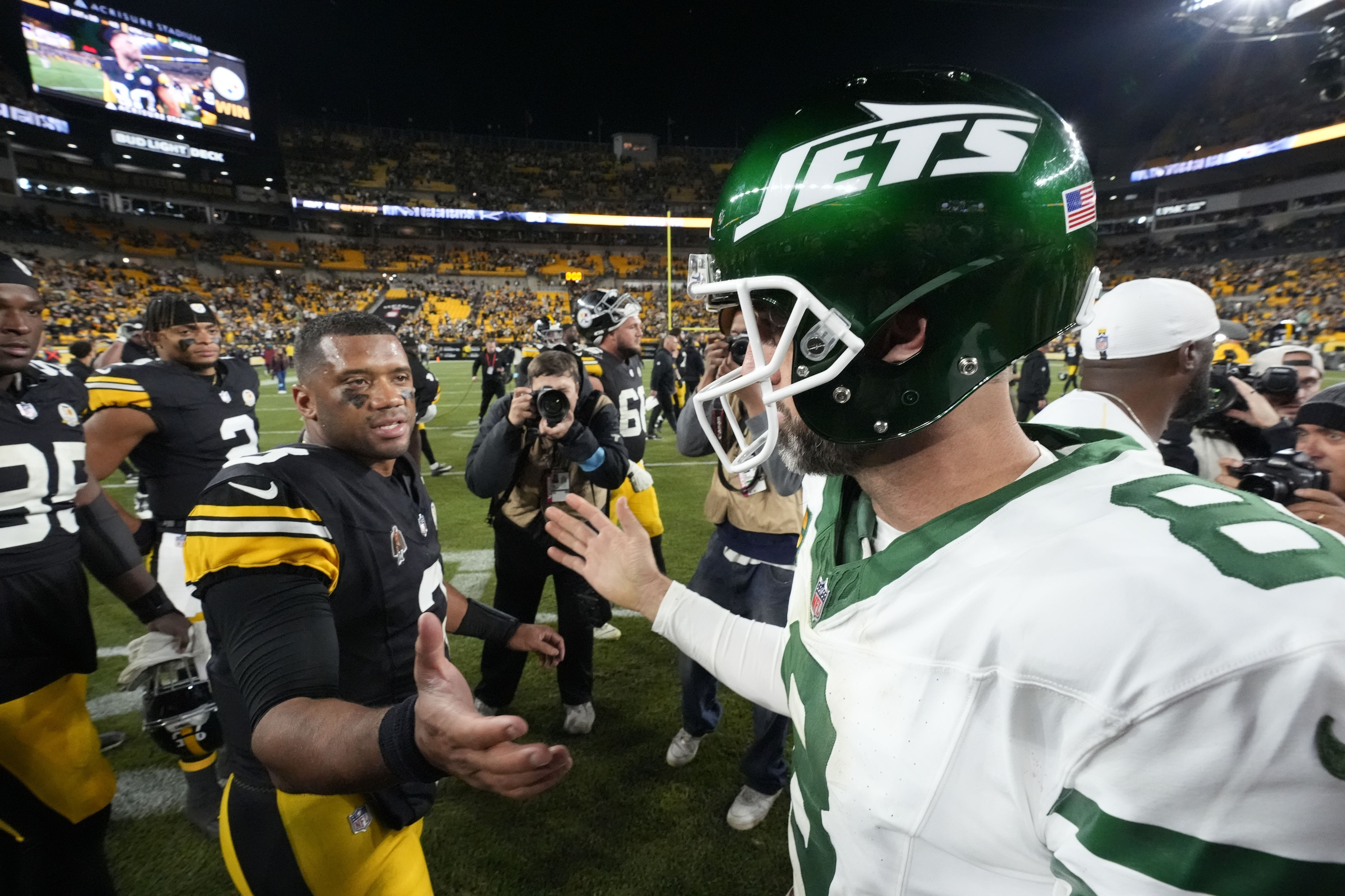 Pittsburgh Steelers quarterback Russell Wilson (3) greets New York Jets quarterback Aaron Rodgers (8).